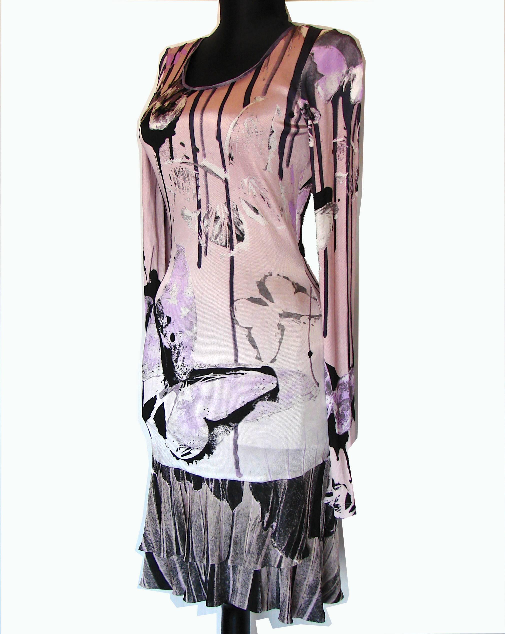 An incredibly chic dress from Roberto Cavalli, features an abstract butterfly print in shades of lavender, black and white.  Slips over the head and unlined.  In excellent pre-owned condition.  Measurements: shoulders - 16