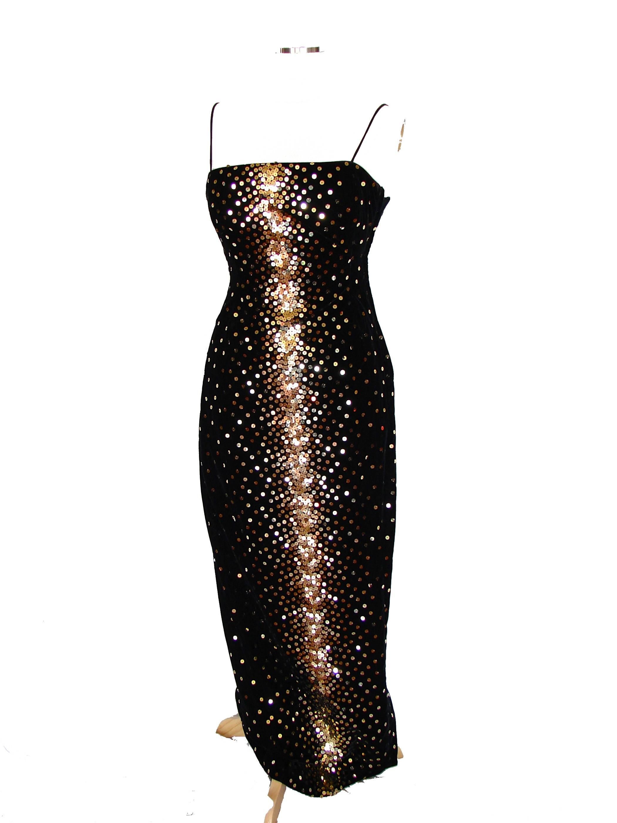 This sparkling evening gown was designed by Morton Myles for The Warrens in the early 1980s. Made from black velvet, it features gold and amber sequins - so festive! In excellent condition, the zipper pull has broken off.  Fully lined. Tagged size