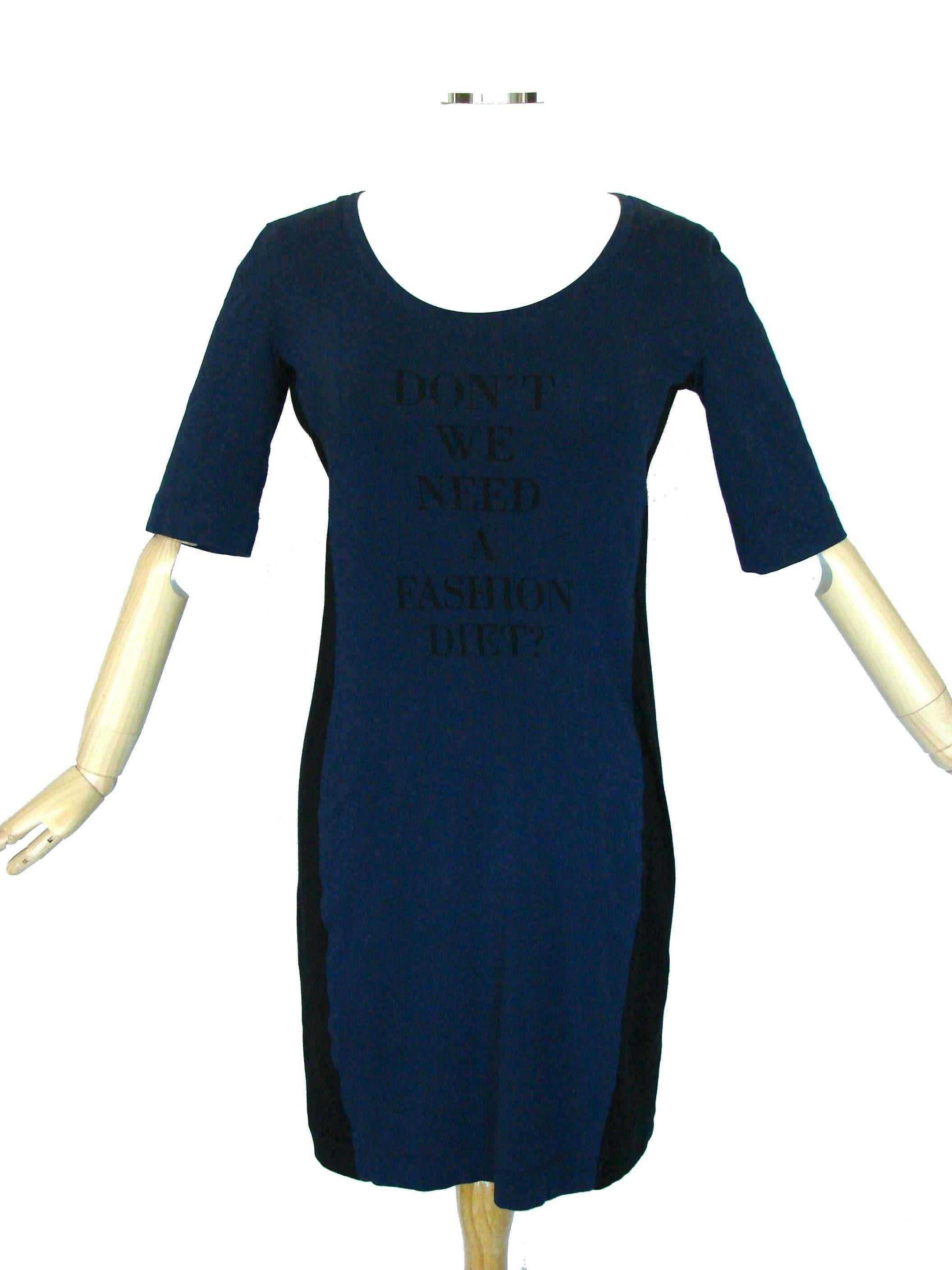 This Franco Moschino designed dress was released in the mid 1980s for his LOVE MOSCHINO line.  Made from a cotton and elastane blend fabric in blue, it features black illusion panels at the sides.  In good condition.  Tagged US 8, it measures,