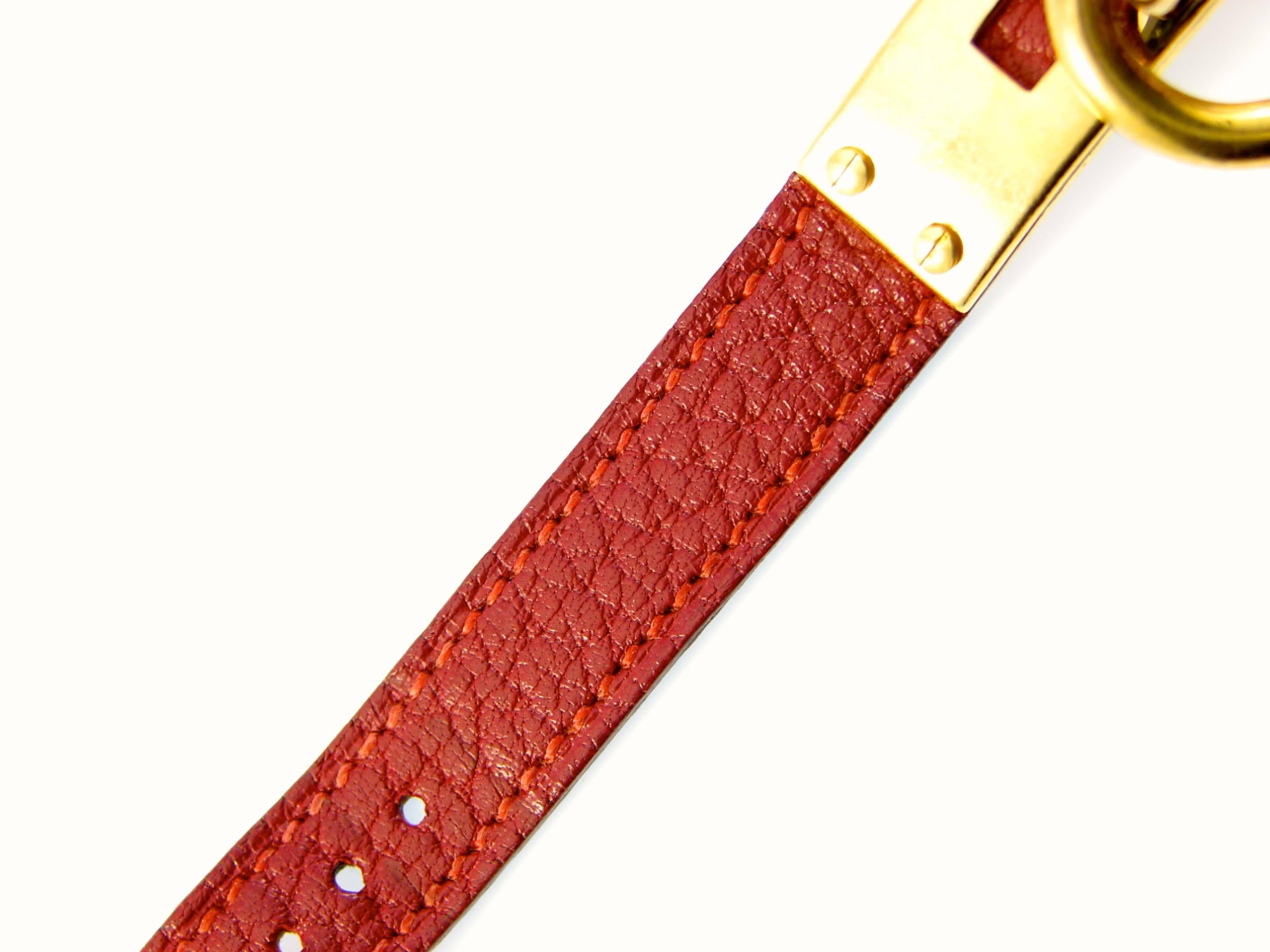 Contemporary Elegant Hermes Paris Gold Kelly Watch with Red Face + Rouge H Leather Strap 90s