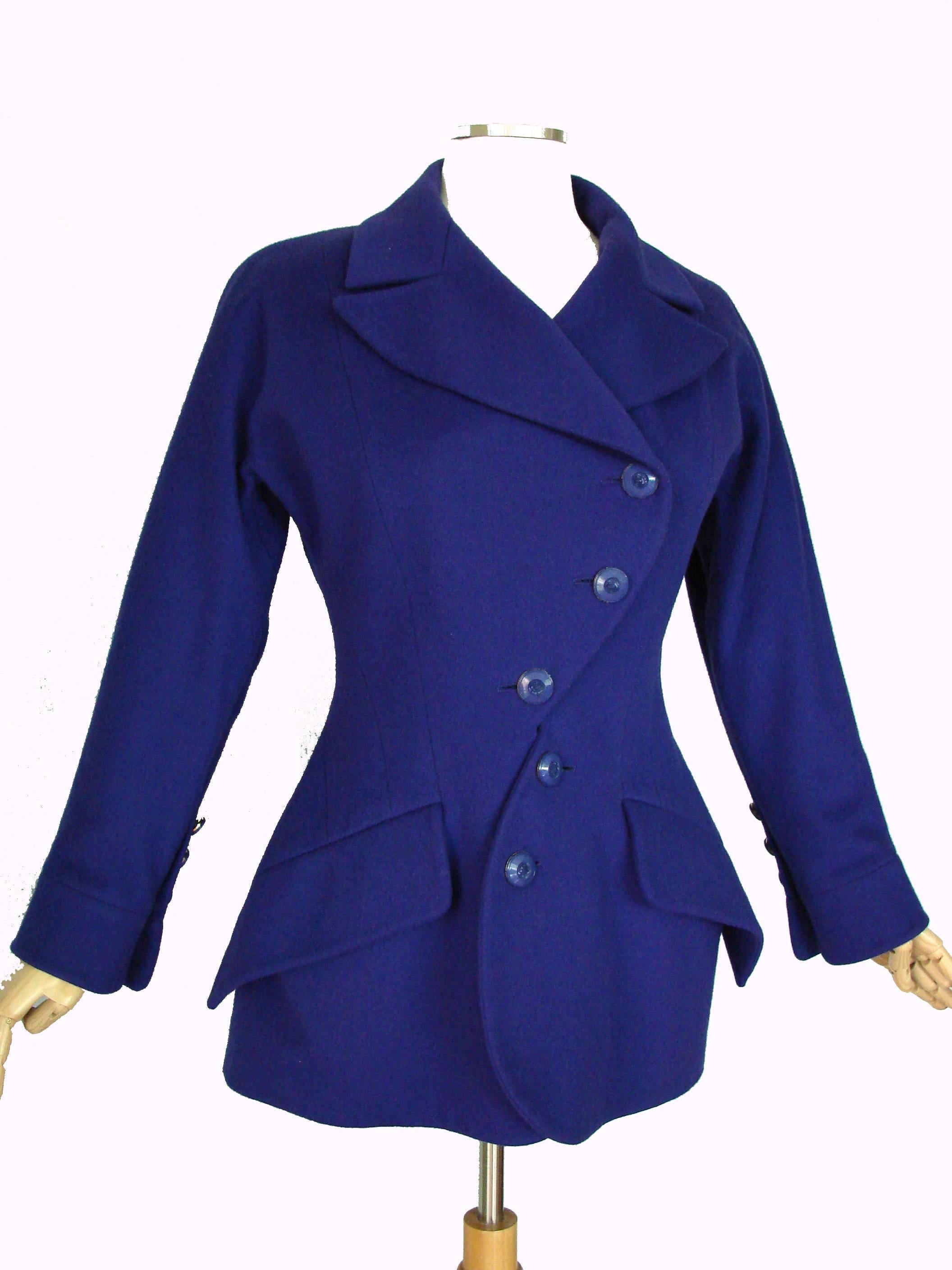 This vibrant jacket was designed by Karl Lagerfeld for his label in the late 1980s and sold by Fred Hayman Beverly Hills.  Made from supple wool, this piece is fully-lined in silk and fastens with decorative buttons.  In good condition with minimal