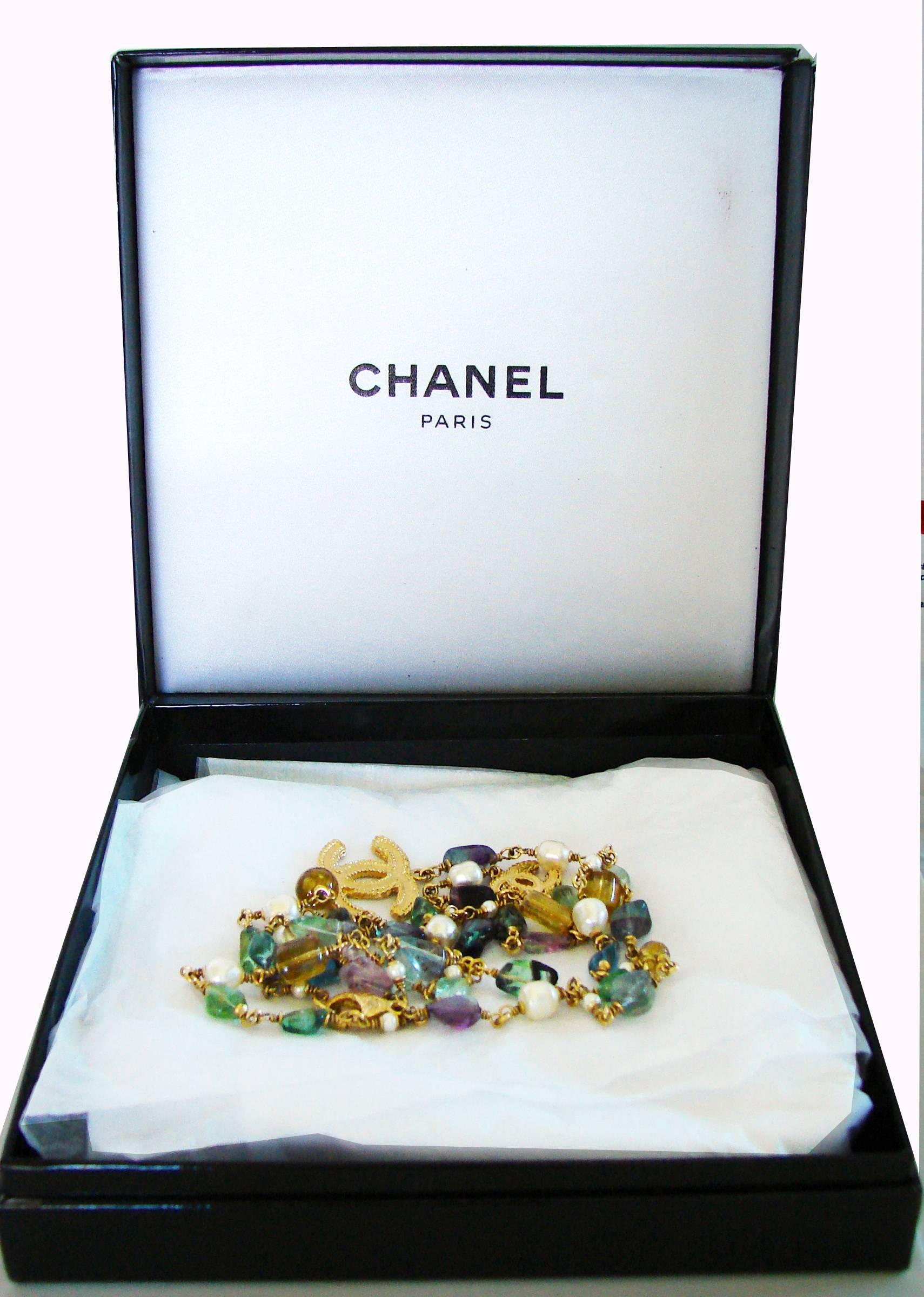 A lovely necklace from Chanel, from their 11A collection.  Features colorful gemstones and the iconic CC logo in gold.  Fastens with a lobster claw.  In excellent condition overall, we note one missing stone - hard to detect unless very closely