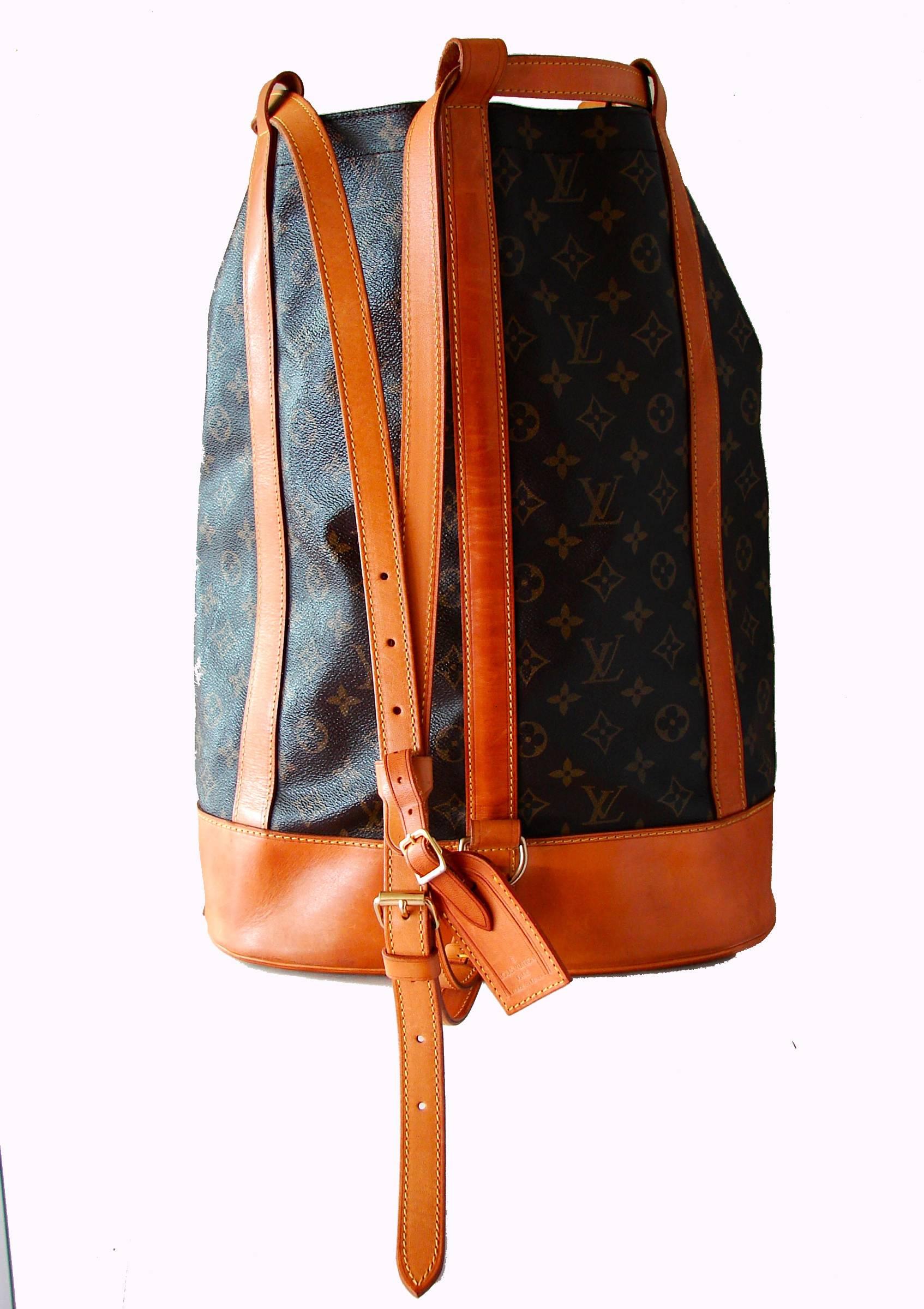 This incredible travel bag was made by Louis Vuitton in 1993.  Made from their signature monogram canvas, it's trimmed in vachetta leather and features a brown canvas interior.  Comes with its original, removable monogram zip pouch and vachetta