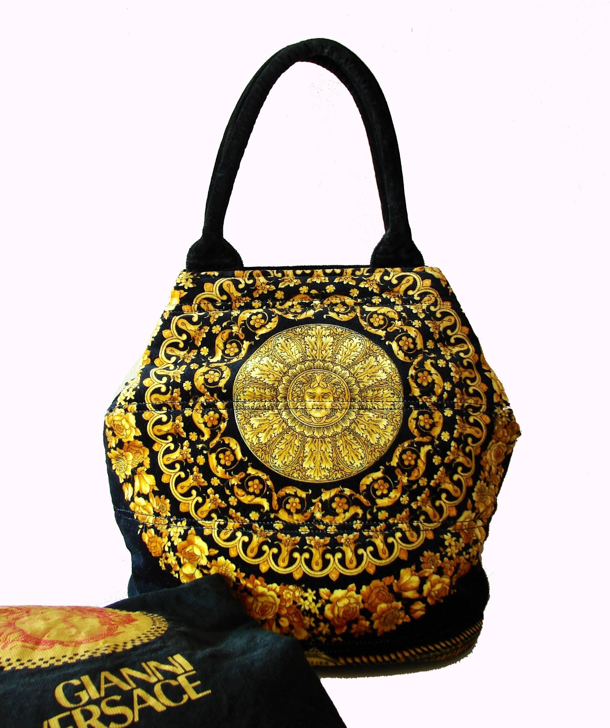 This incredible bag was made in the early 1990s by Versace for his couture label - very similar to the reboot of baroque designs that Donatella recently showed at Milan Fashion week.  Made from black velvet, it features the signature Medusa head in