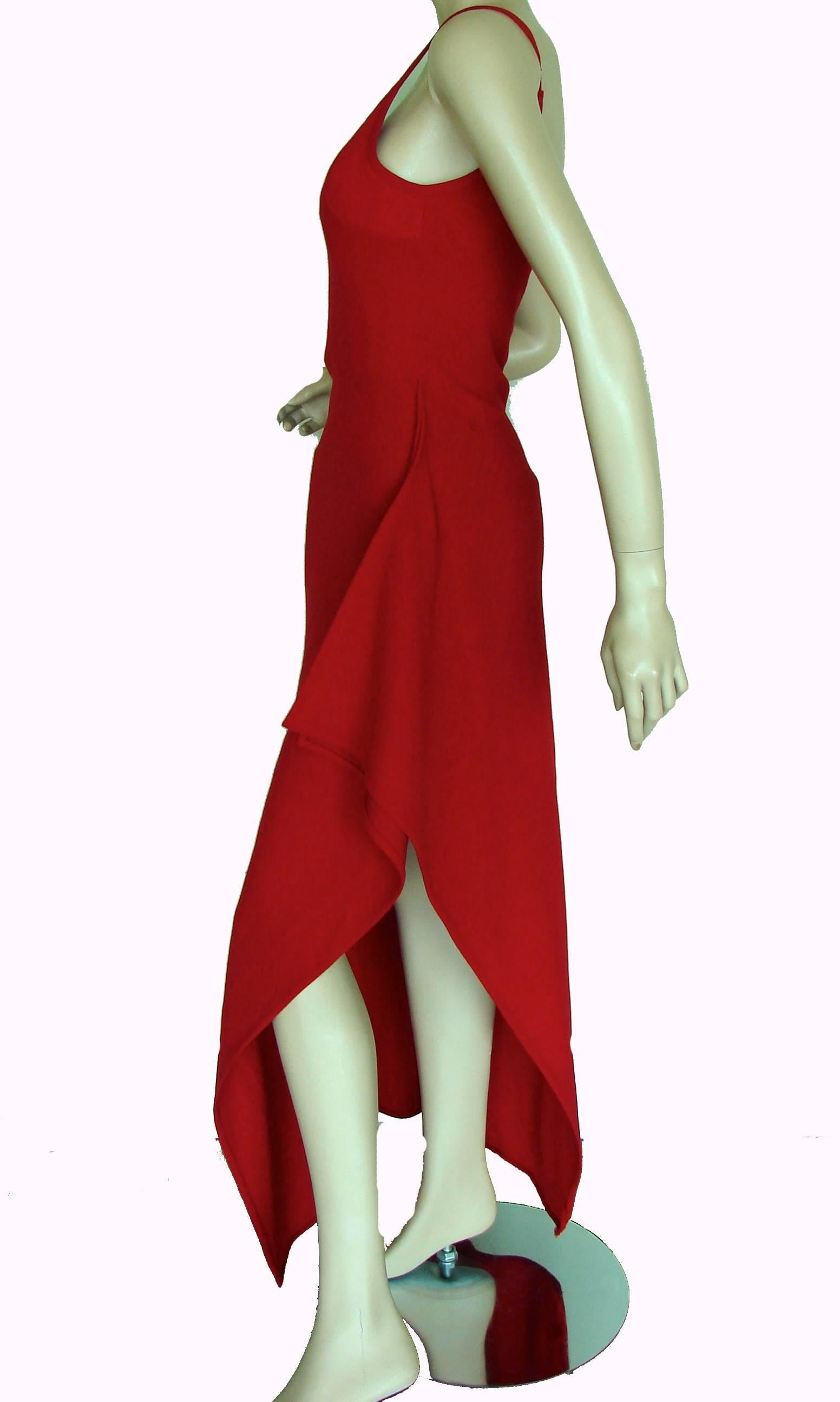 This vibrant dress is from Gianni Versace Couture, from the early 1990s.  It features a separately zippered silk-covered bustier section on the interior, giving the wearer just the right amount of sexy top boost (see photo 6).  The dress is unlined