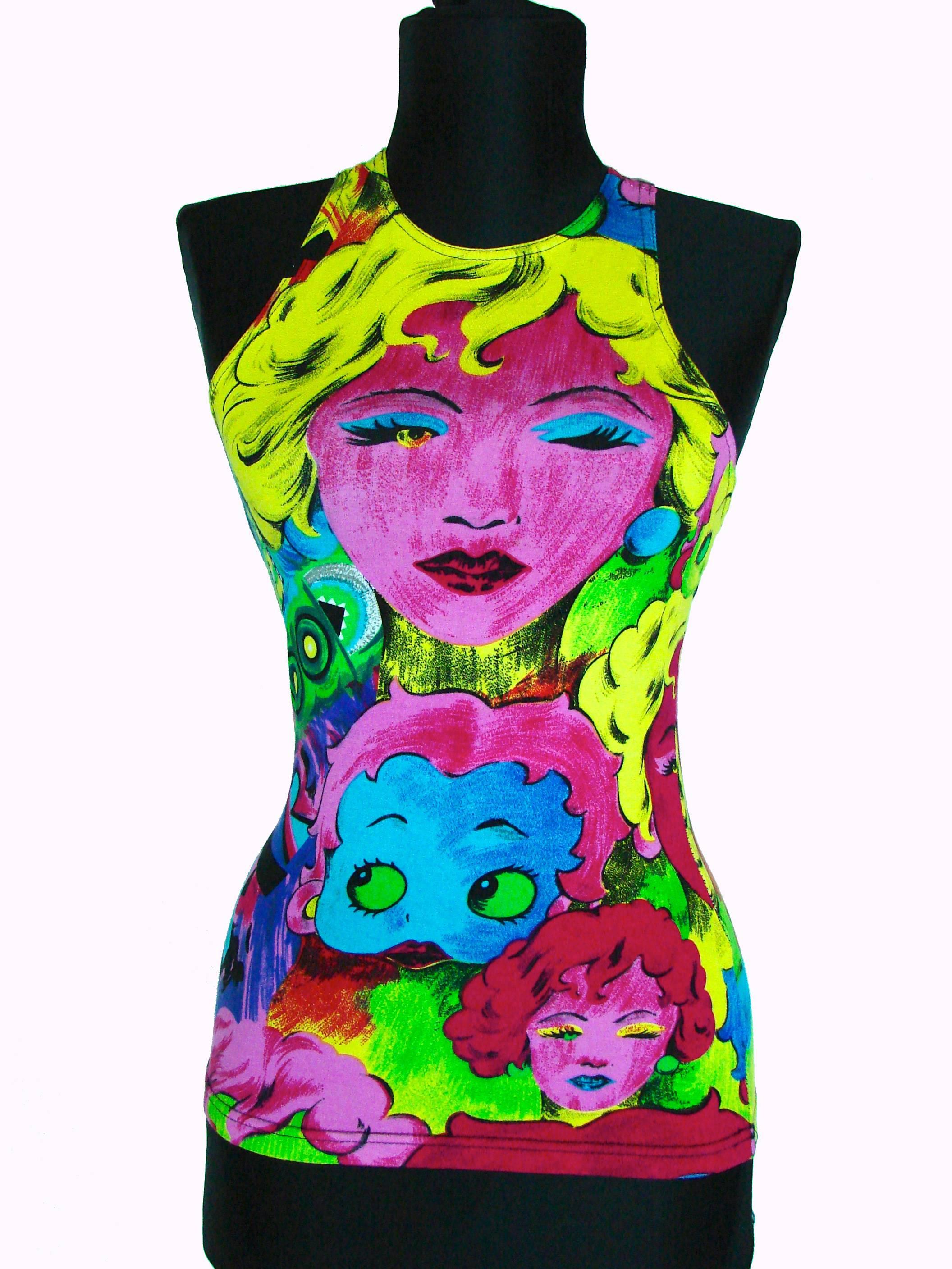 This fabulous Versace Jeans Couture tank top features eye-popping colors and images of Betty Boop, Marlene Dietrich and others.  In excellent condition, it's tagged an XS and measures, laying flat and doubled where appropriate: bust - 34in, waist -