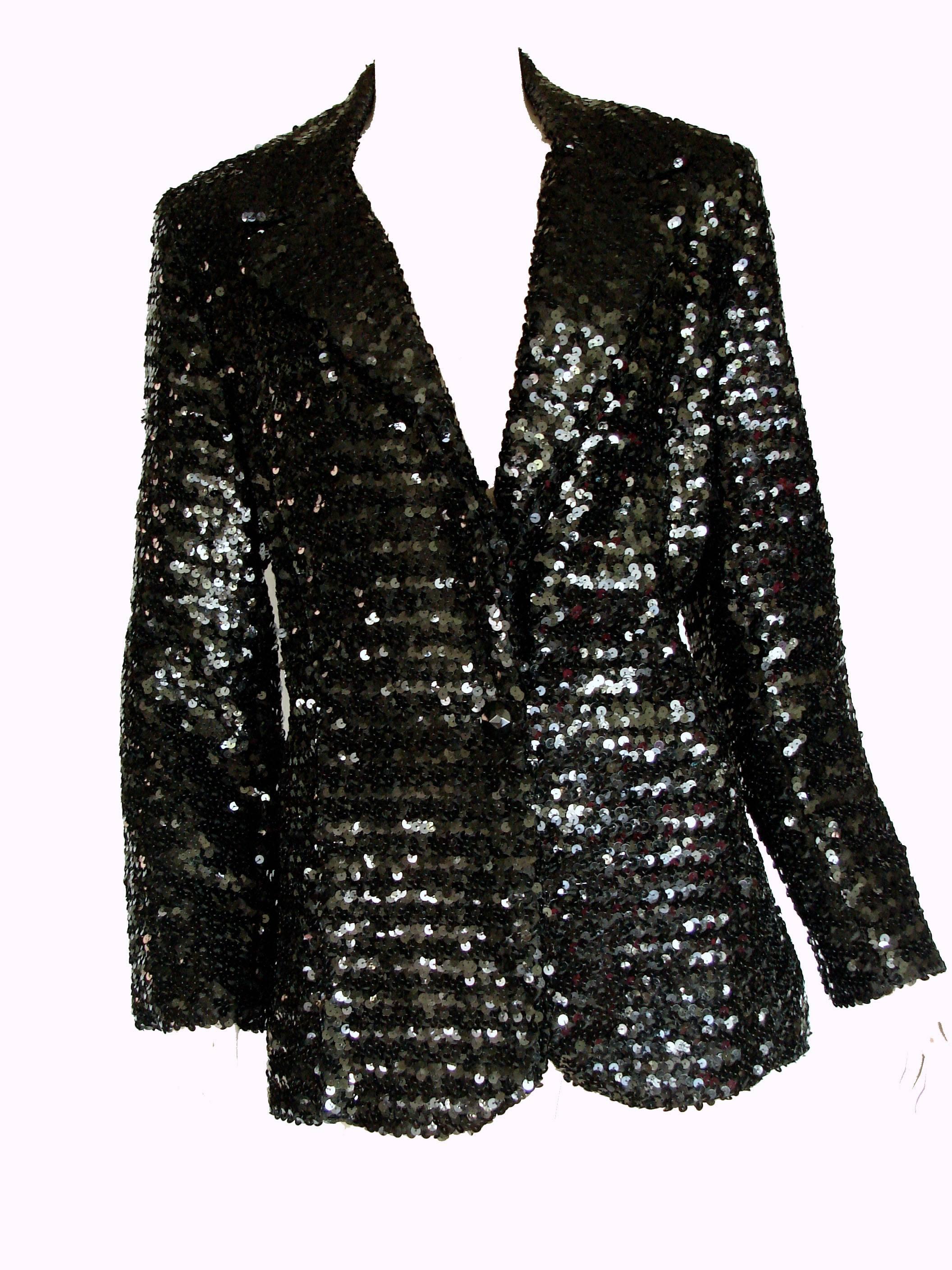 This sparkling jacket was made by Jack Hartley Miami in the late 1970s.  Fully-lined in black satin, it looks amazing with the sleeves rolled up and a pair of jeans.  In excellent vintage condition.  Small shoulder pads.  Fastens with a black resin