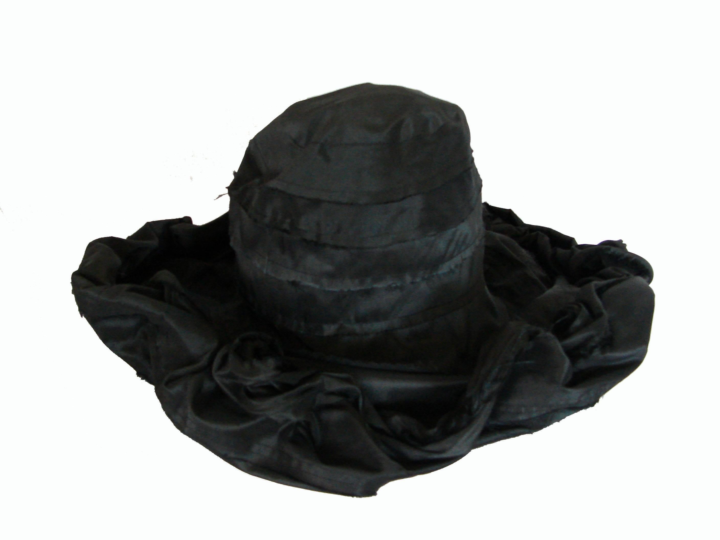 An extremely rare hat from Ivan Grundahl Copenhagen.  Made from silk taffeta, the brim features a bendable wire frame so that one can adjust and style the hat in a variety of ways.  New with tags and in perfect condition.  One size fits most.
