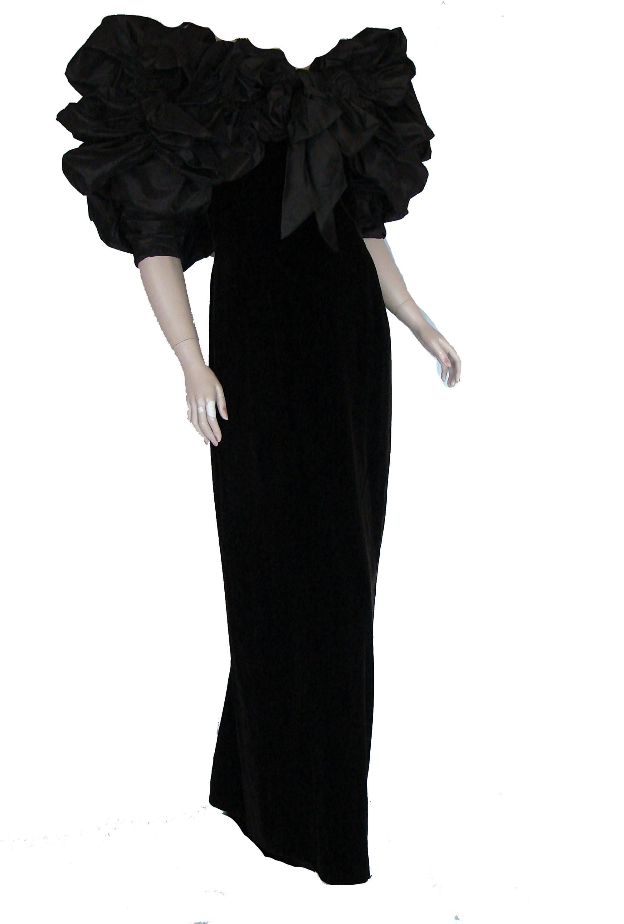 Looking to make an entrance at your next event? This show stopper from Bill Blass will do the trick! The silk taffeta bodice is so over the top!  The puff sleeves are shirred down the inner arm and the giant shirred and pouf neck ruffle is attached