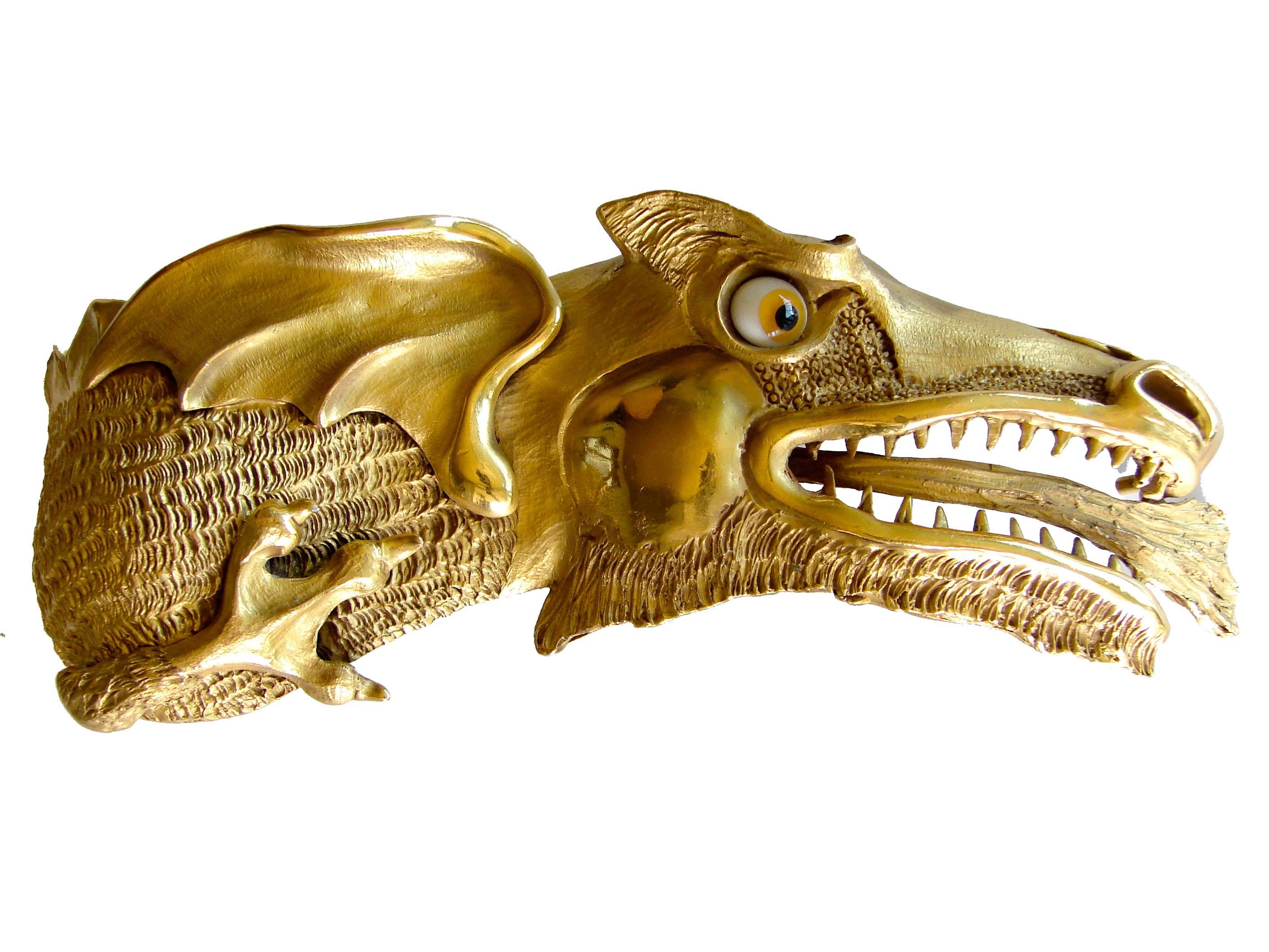 This unique belt buckle was created by sculptor Christopher Ross in the 1980s.  Made from 24k gold plated metal, it measures 7