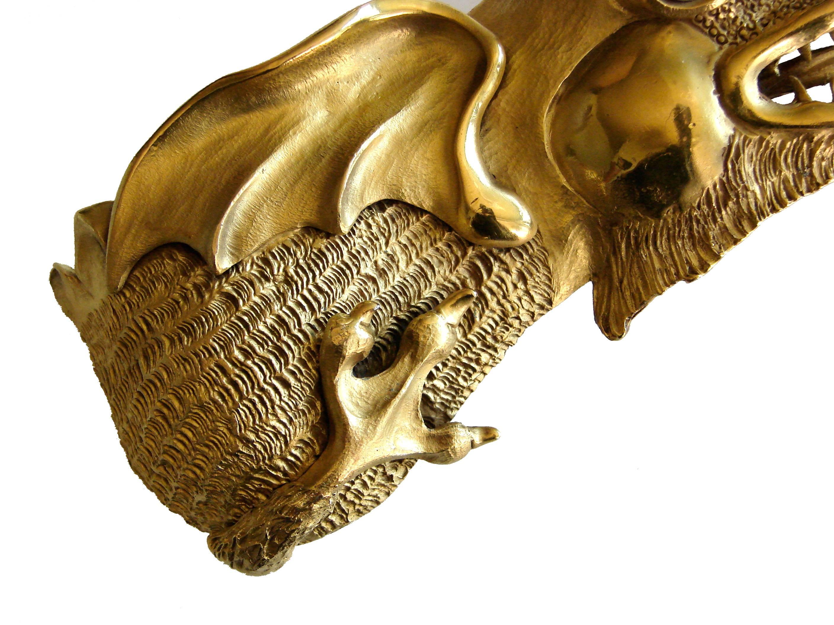 gold dinosaur belt buckle