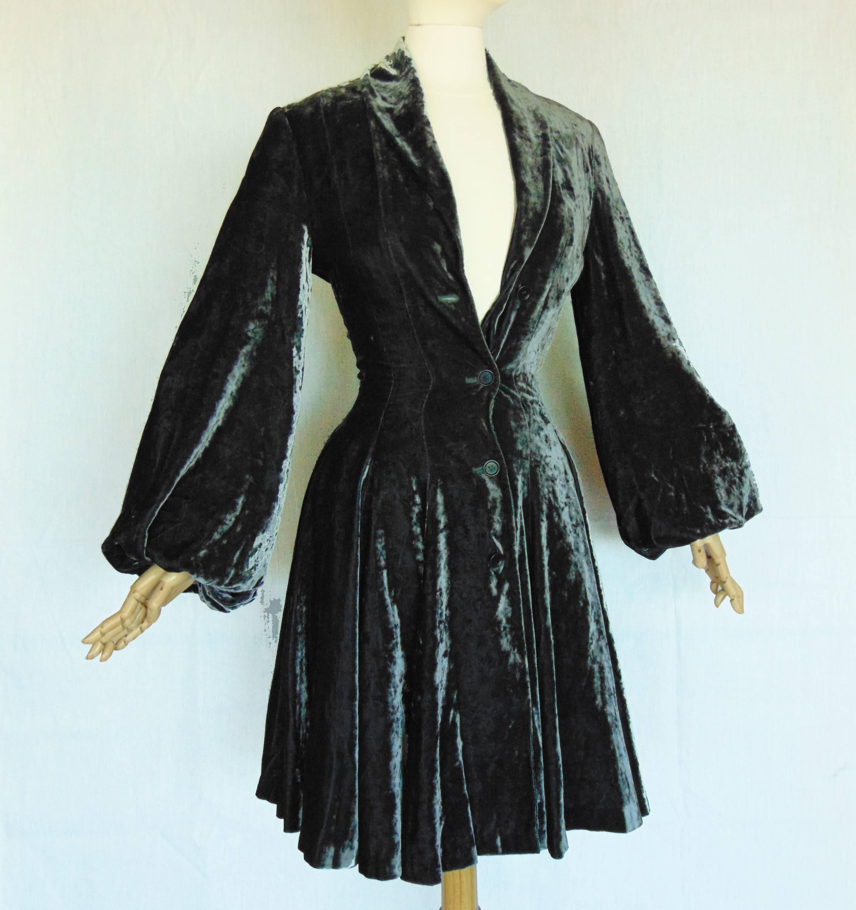 Here's a romantic silk blend velvet jacket from Norma Kamali, circa the early 1980s. Fully-lined and in excellent condition, this piece is new old stock from the 1980s and came with a partial store tag, indicating that it originally retained for