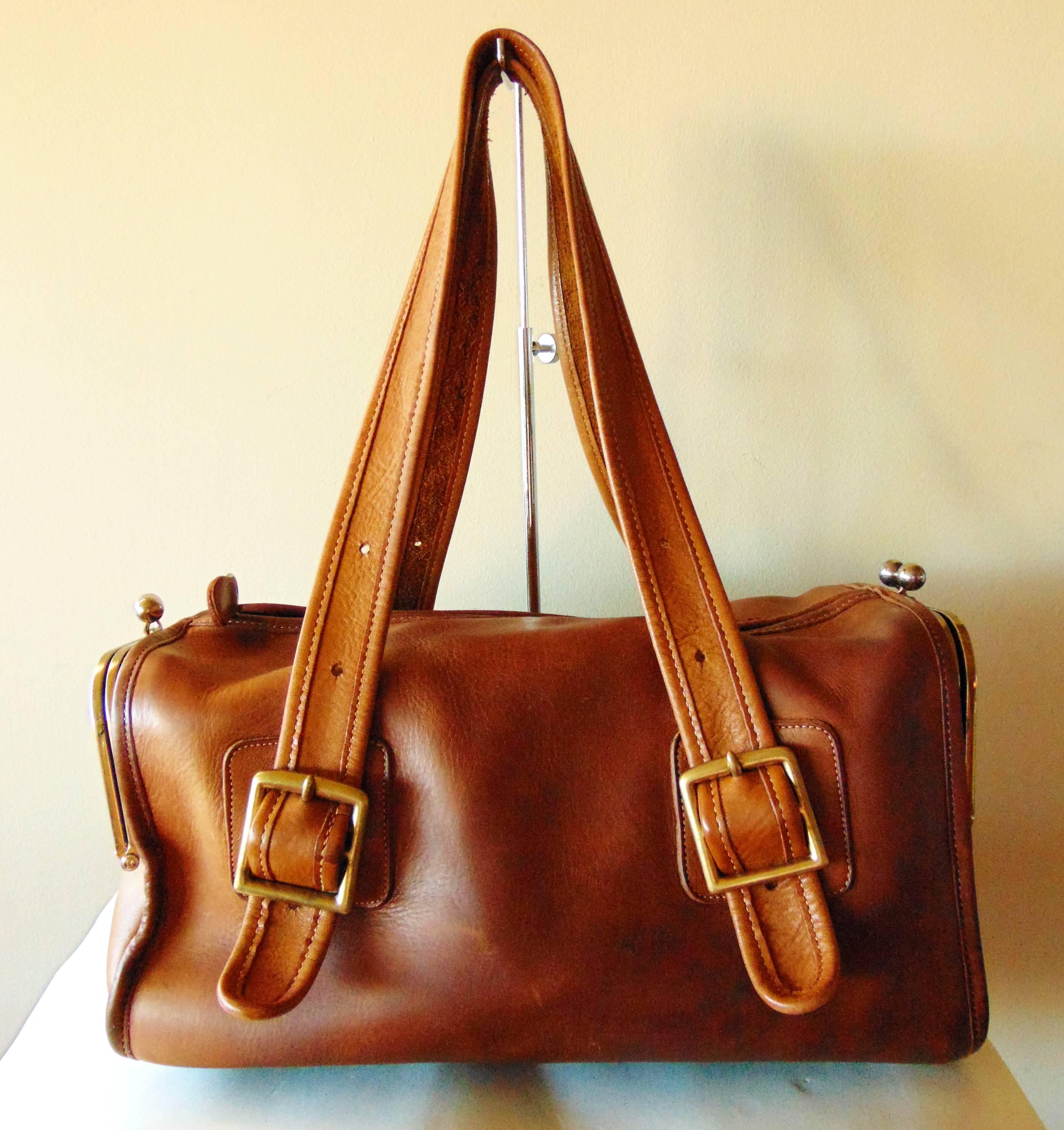 This fabulous and hard-to-find bag was designed by Bonnie Cashin for Coach Leatherware in the early 1970s.  Coined the 