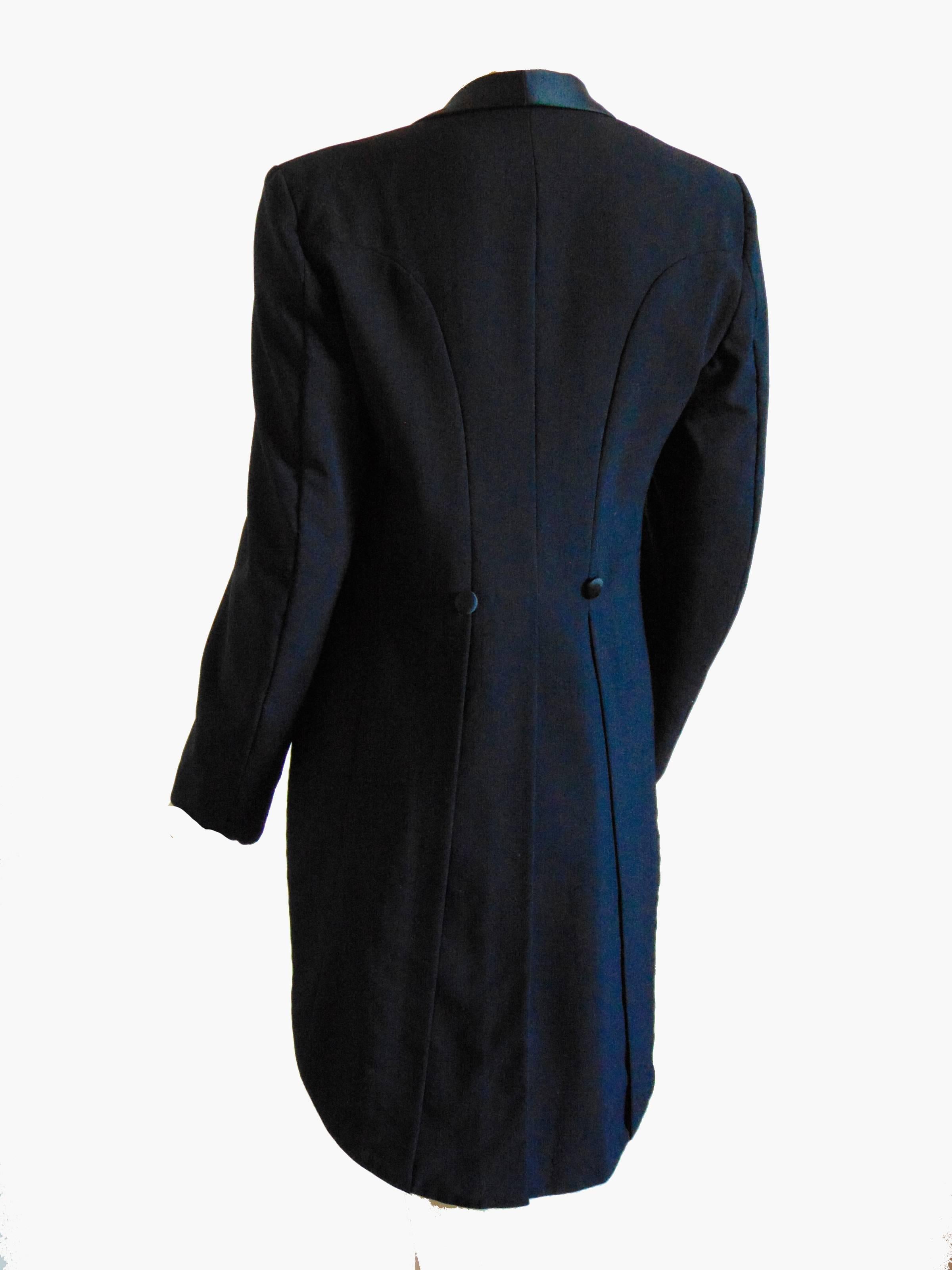 Here's a cool black tuxedo jacket from Christian Dior for their Jeune Homme collection for young men.  Made from black wool with black silk satin trim, it's fully lined and doesn't fasten.  No size tag, but we're estimating this as a modern size