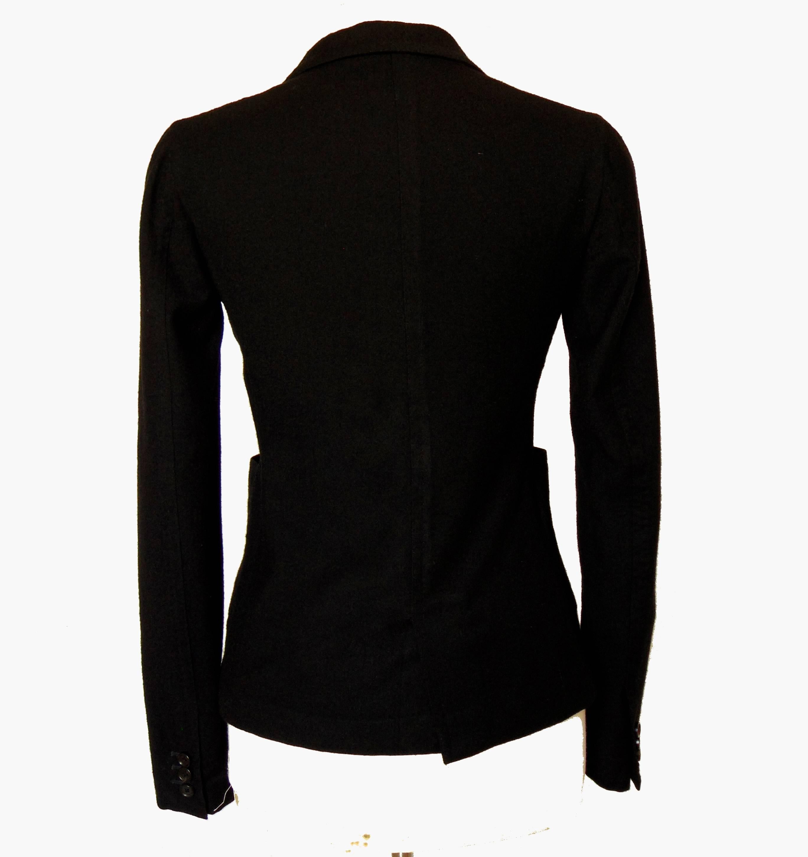 This classic jacket is made from a super soft boiled wool, is unlined.  In excellent pre-owned condition with minor signs of prior wear.  It measures, taken flat and doubled:
shoulders - 16