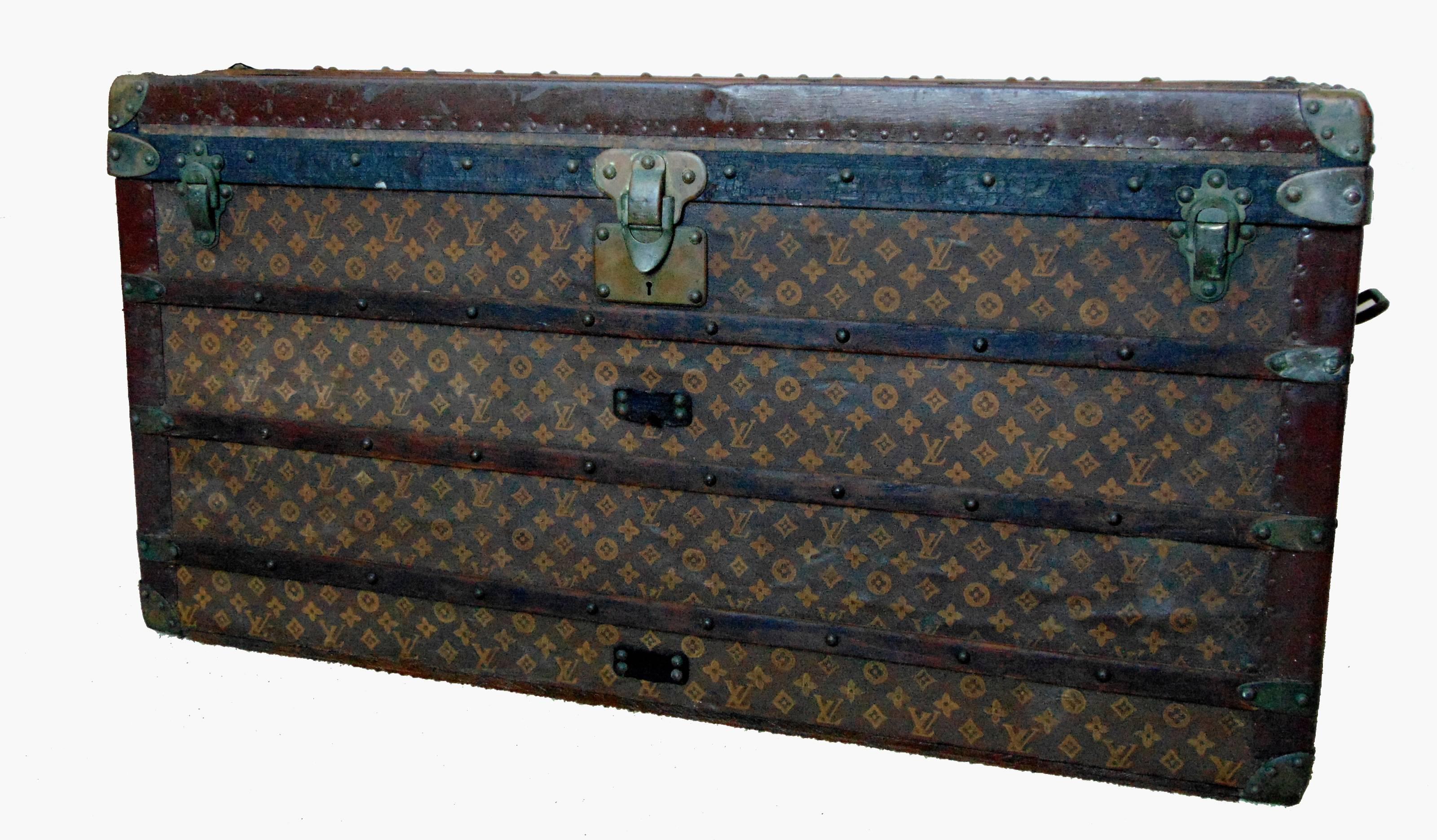 This impressive steamer trunk was crafted by Louis Vuitton, most likely in the early 1900s.  Made from stenciled monogram canvas, this piece is substantial in size and measures 43.5inL x 23inD x 23inH, making it perfect for use as a coffee table or