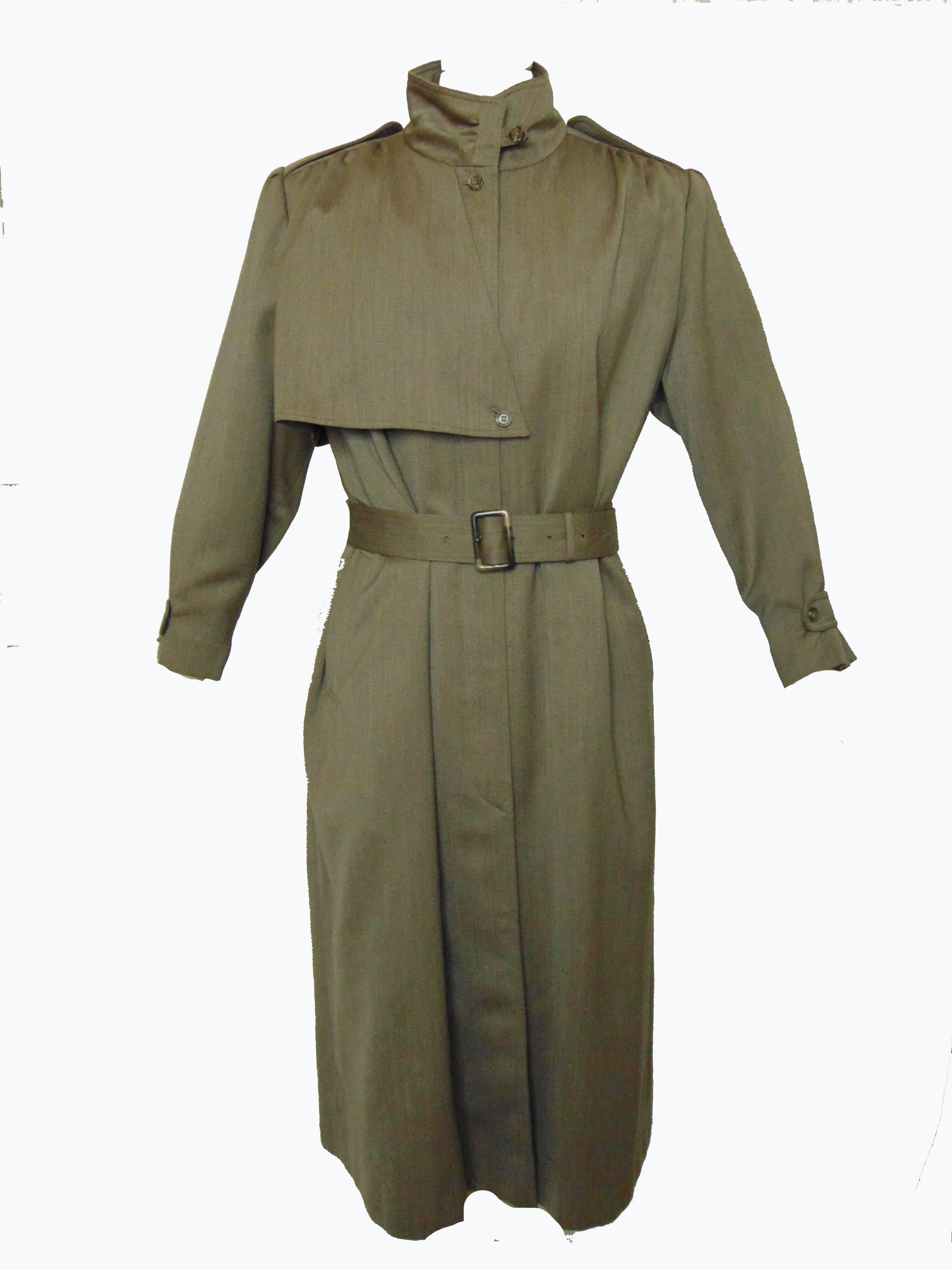 This trench coat was created by Sanyo exclusively for Saks Fifth Avenue, most likely in the early 1990s.  The shell is made from 100% wool and the removable warmer is a wool/nylon blend.  Tagged size 10, it measures: shoulders - 17