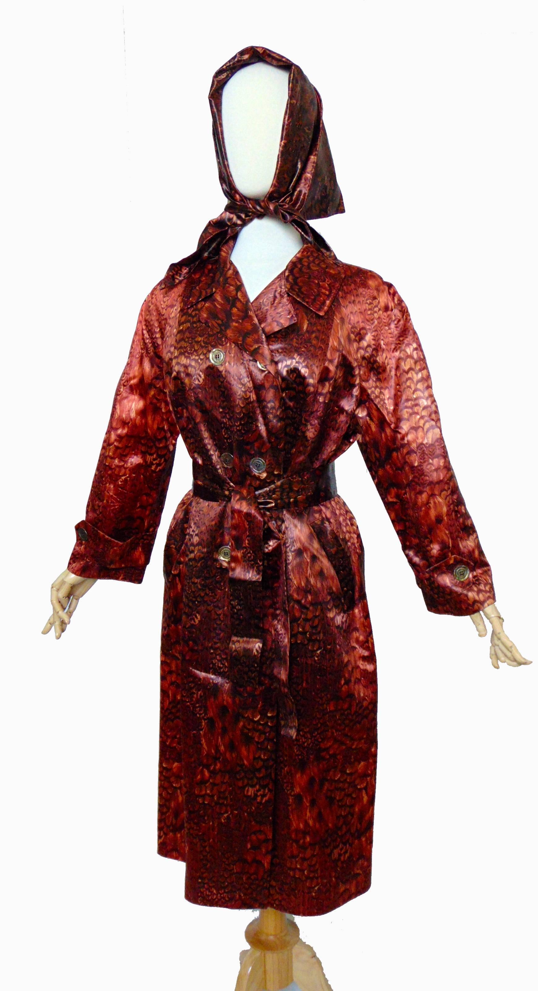 Lovely 3pc raincoat ensemble from the 1960s includes the coat, scarf and belt.  Label reads: Main Street Fashion Rain Sun Storm Coat.  Very unique feather print!  In perfect condition, new old stock without tags. No content label but feels
