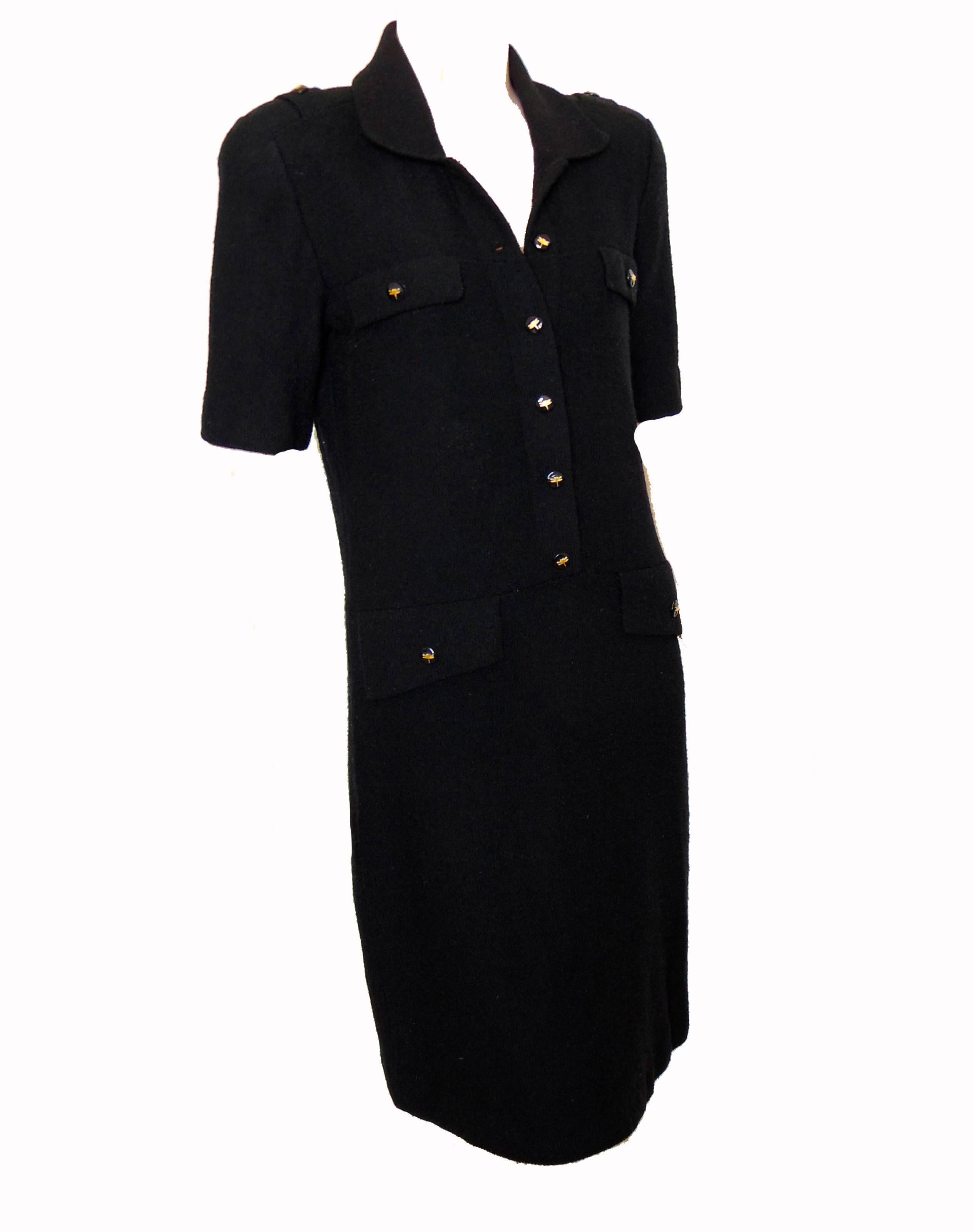 This black knit dress was made by Steve Fabrikant for Neiman Marcus, likely in the 1990s.  Unlined and in excellent condition, it fastens with several dragonfly embossed buttons.  No size tag, but we're estimating this as a modern size M, based on