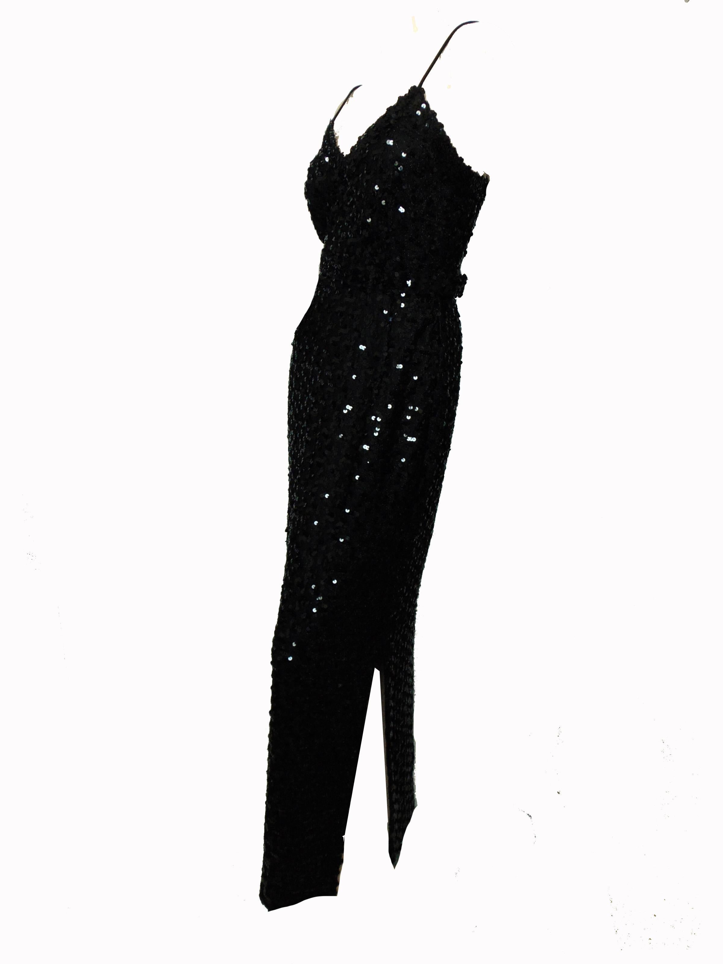 Here's a simple yet sexy evening gown by Lilli Diamond California, likely made in the 1970s.  Made from a stretchy knit fabric with tons of black sequins, this dress is cut to show off one's curves and features a side vent on the left side of the