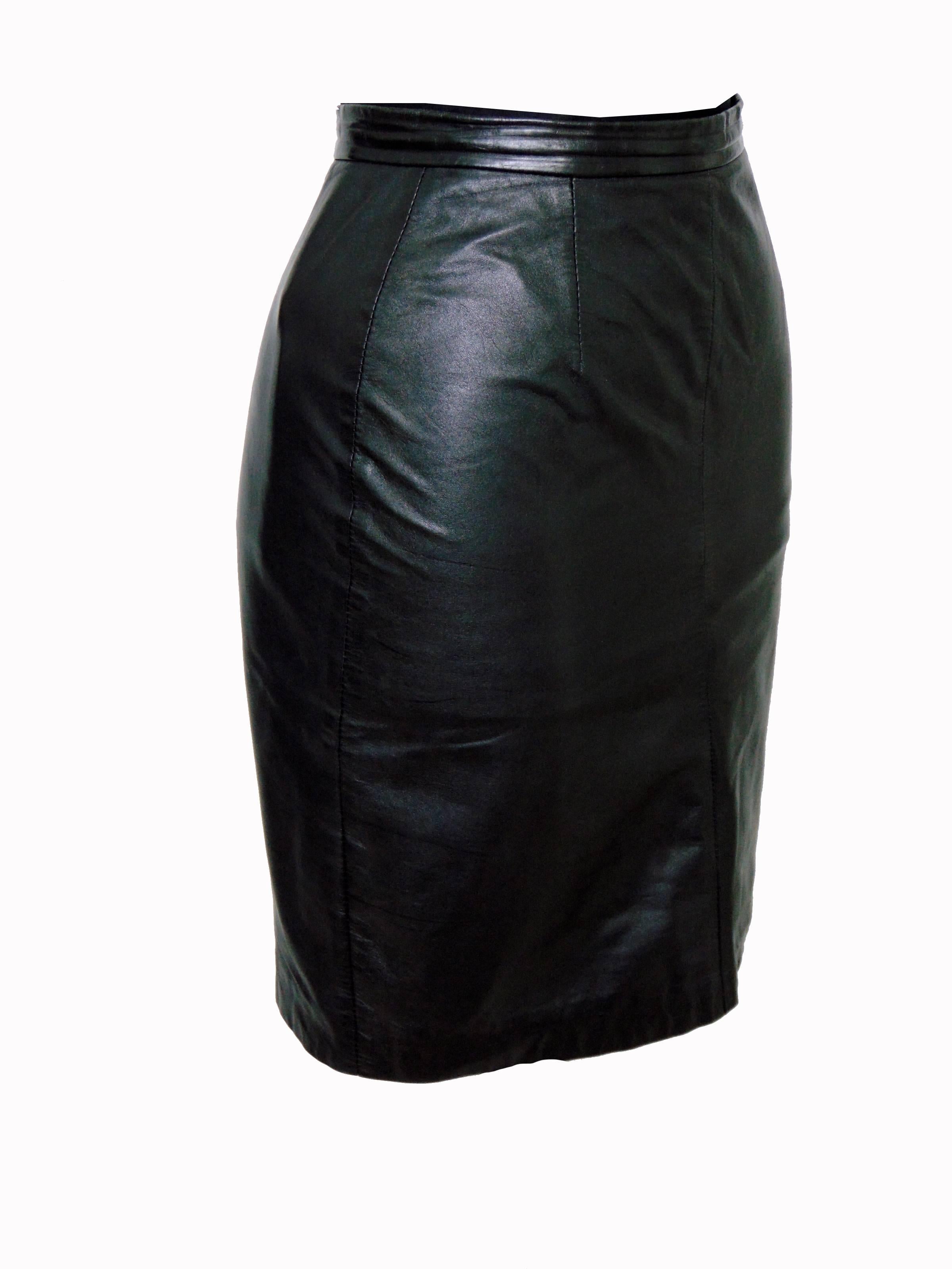 This chic little pencil skirt was made by Michael Hoban for North Beach Leather, most likely in the 1980s.  Fully-lined with a small rear vent and in very good condition overall, with minor signs of wear. Tagged size 3/4, this piece measures: waist