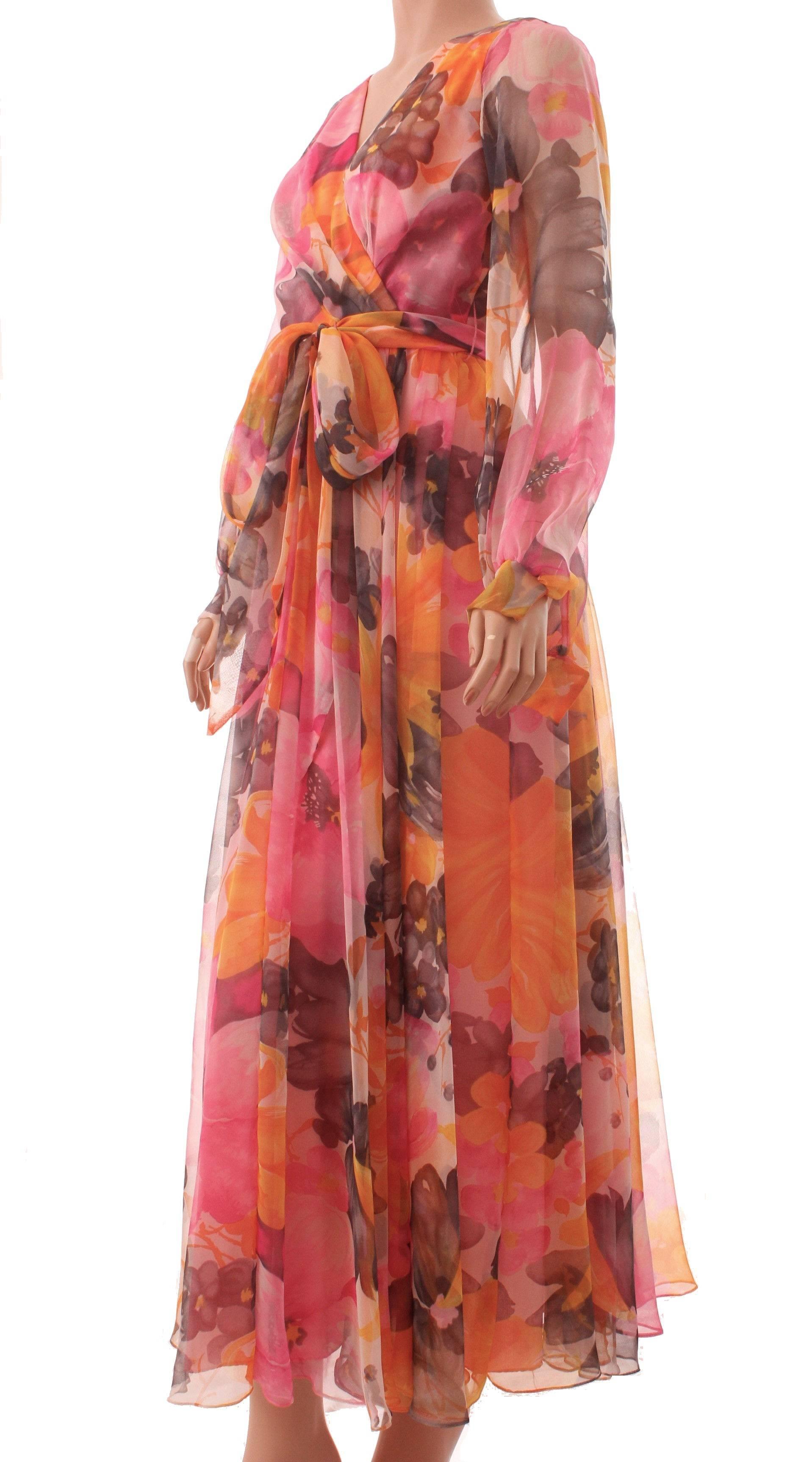 Here's a pretty maxi dress designed by Dupuis for Jack Bryan.  Made from a floral print sheer chiffon fabric, the sleeves are sheer and ethereal.  Fully lined at bodice and skirt.  In excellent condition for its age.  Tagged size 8, it measures,