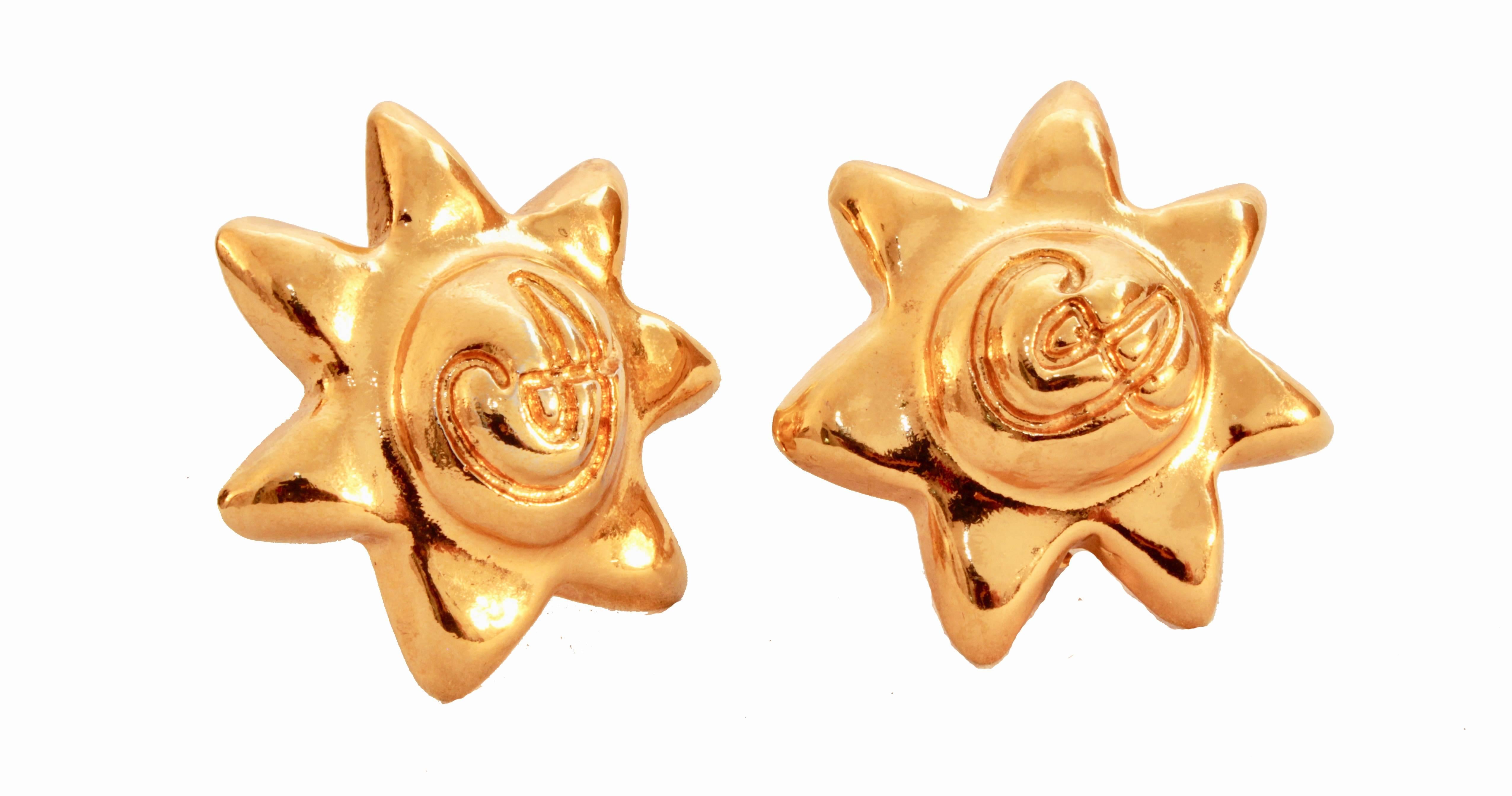 These chunky star earrings were made by Christian Lacroix, most likely in the early 1980s.  Made from a light weight gilt metal, they feature Lacroix's CL logo in front and fasten clip-style.  In excellent condition for their age, we note some color