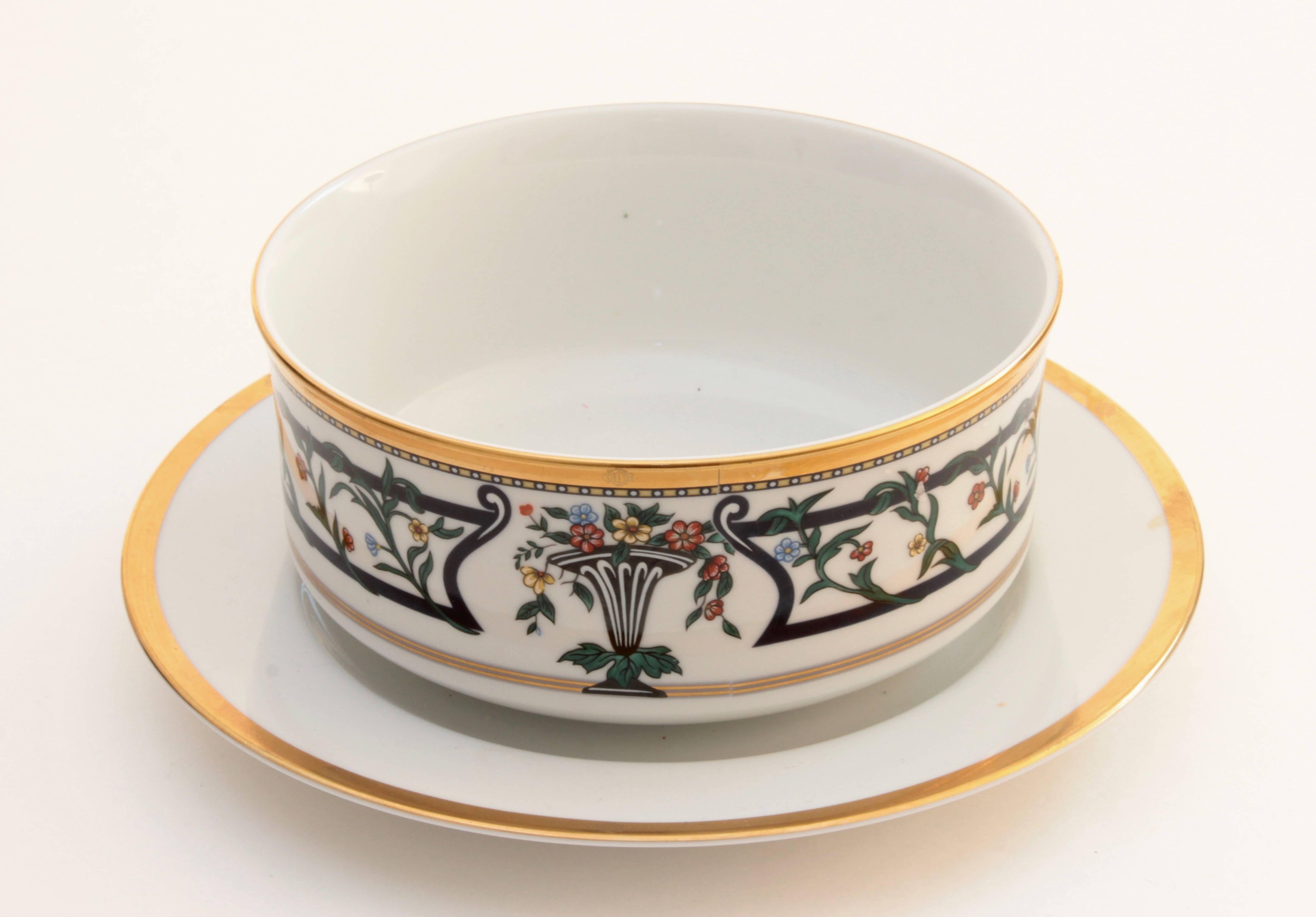 This porcelain china gravy boat was designed by Christian Dior during the late 1990s.  This piece is new/old stock, still retains its retail sticker (marked out to prevent retail returns) and is in excellent unused condition.  The bowl measures