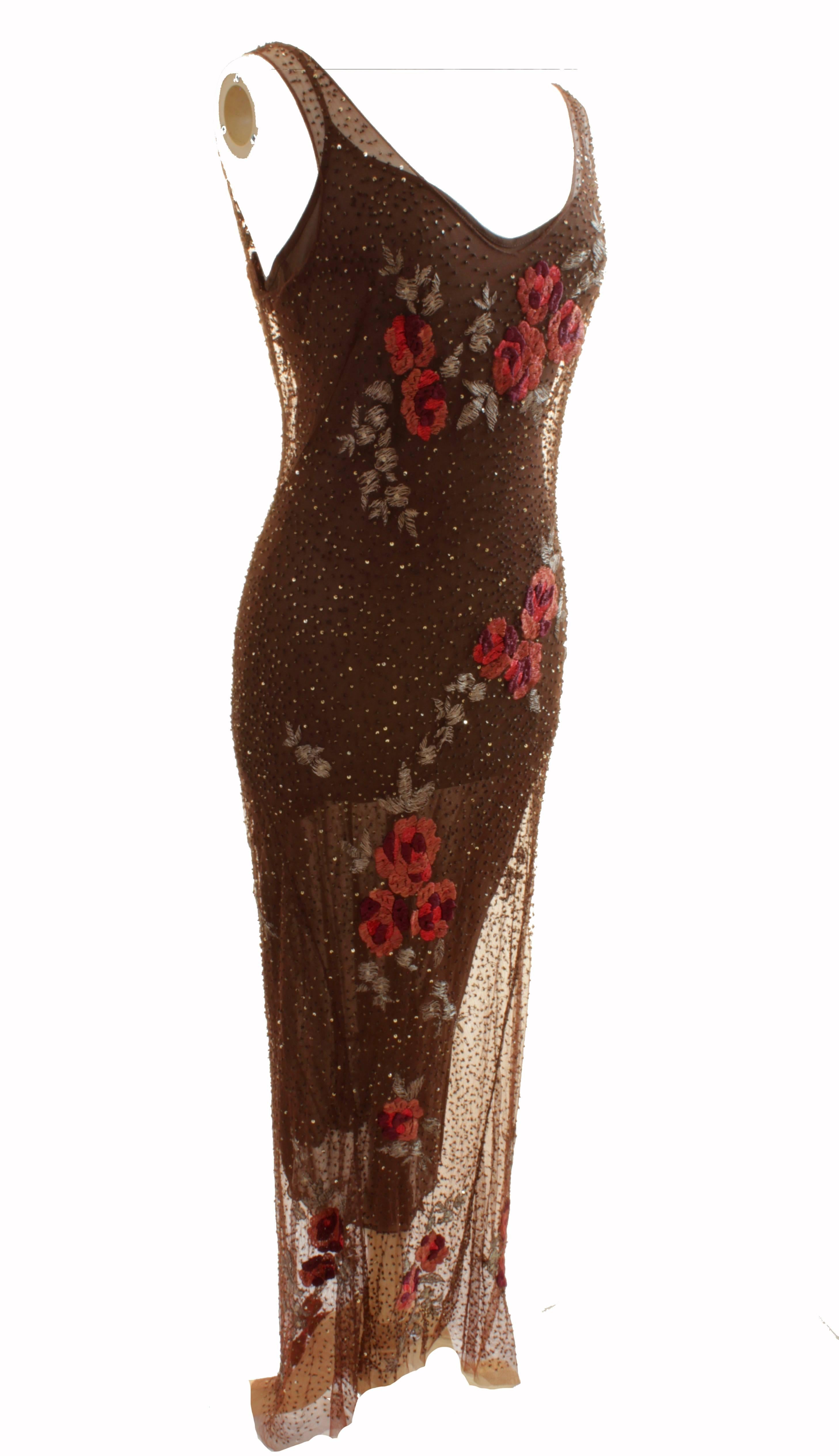 This brown slip dress with floral embroidery overlay was made in Italy but sadly the designer label tag is missing.  We were told the dress was made by Dolce & Gabbana, but without a tag, we cannot say with certainly.  Regardless, this set is two
