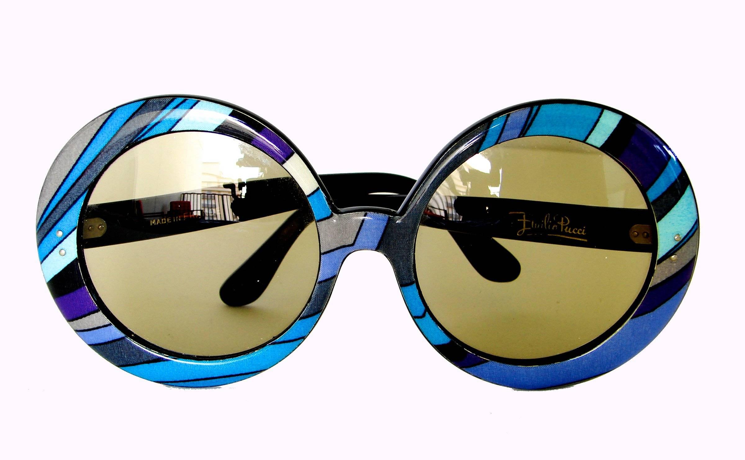 These incredible sunglasses were made by Emilio Pucci in the early 1970s. All original, and come with their original white plastic case, too! In very good vintage condition, we note some minor bend to one of the arms, see image 6. Lenses are clear!