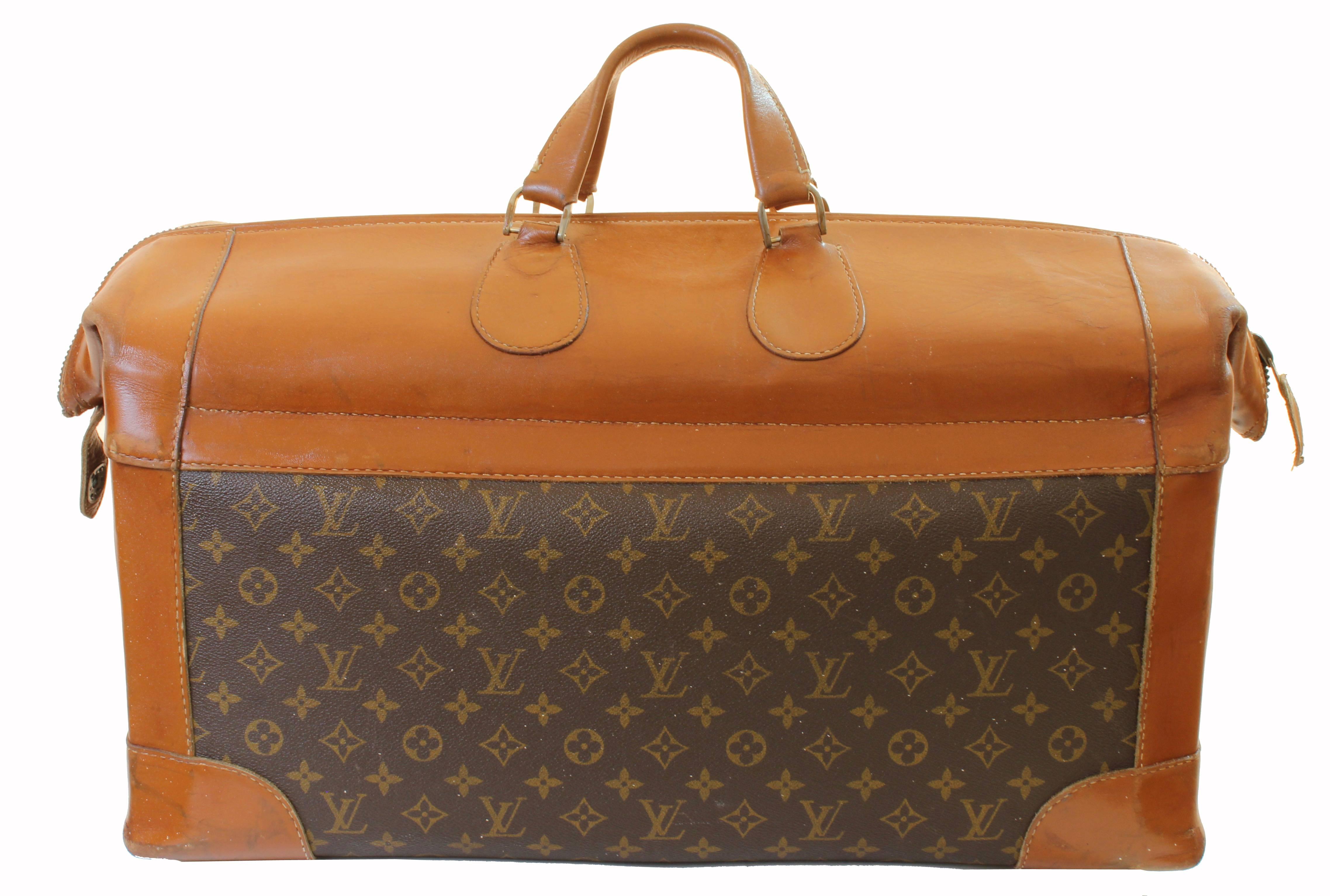 Travel in style with this ultra rare travel bag from Louis Vuitton!  It was made by The French Company under special license from Louis Vuitton, most likely in the early 1970s, and long before LV had a manufacturing presence n the USA. These US made