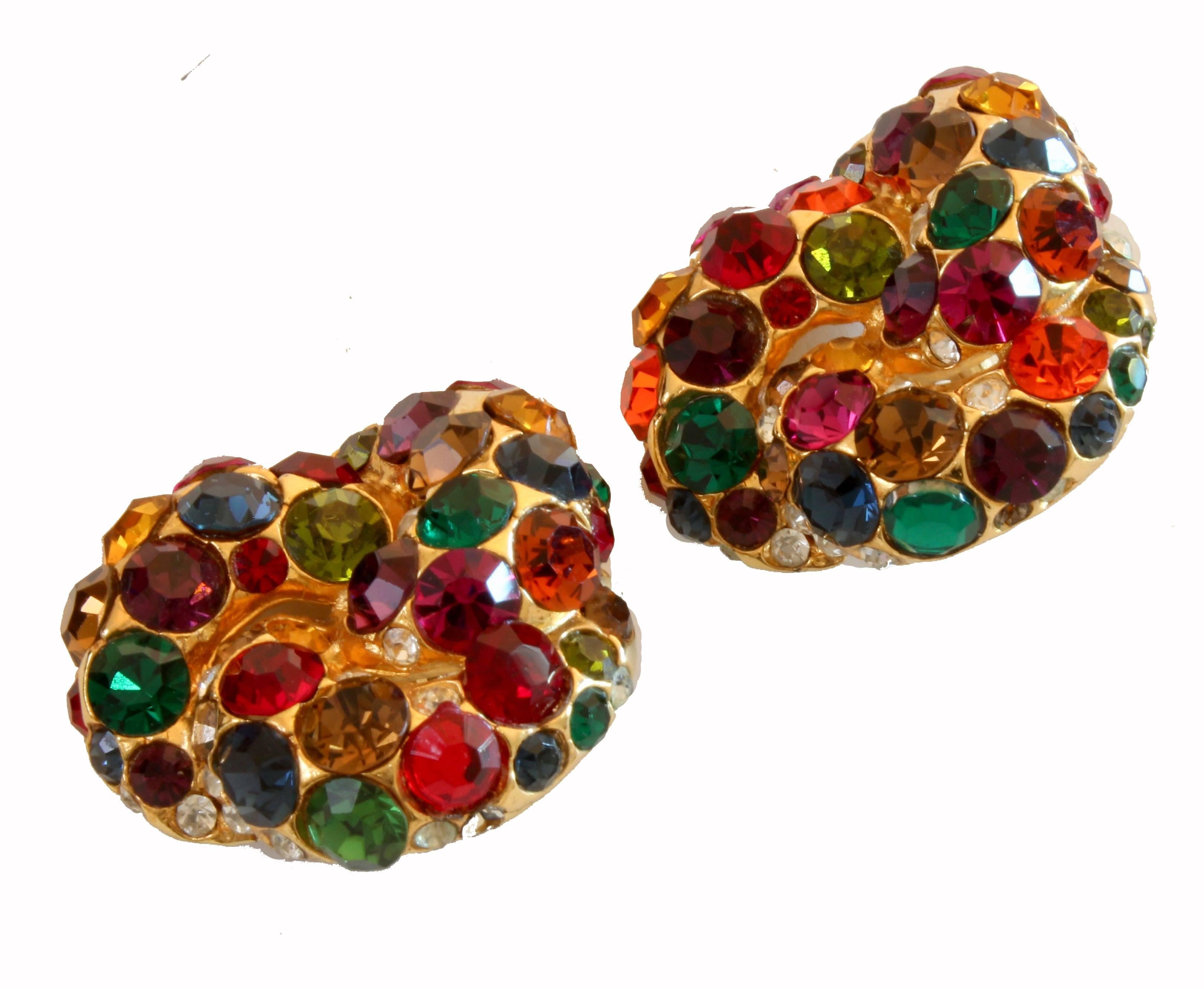 Here's a cool pair of earrings signed BLANCA.  Made from gold metal, these clip style earrings are covered in multi-color rhinestones.  Perfect for making a statement! They measure appx 1.5in H x 1.45in W.  In very good preowned condition with some