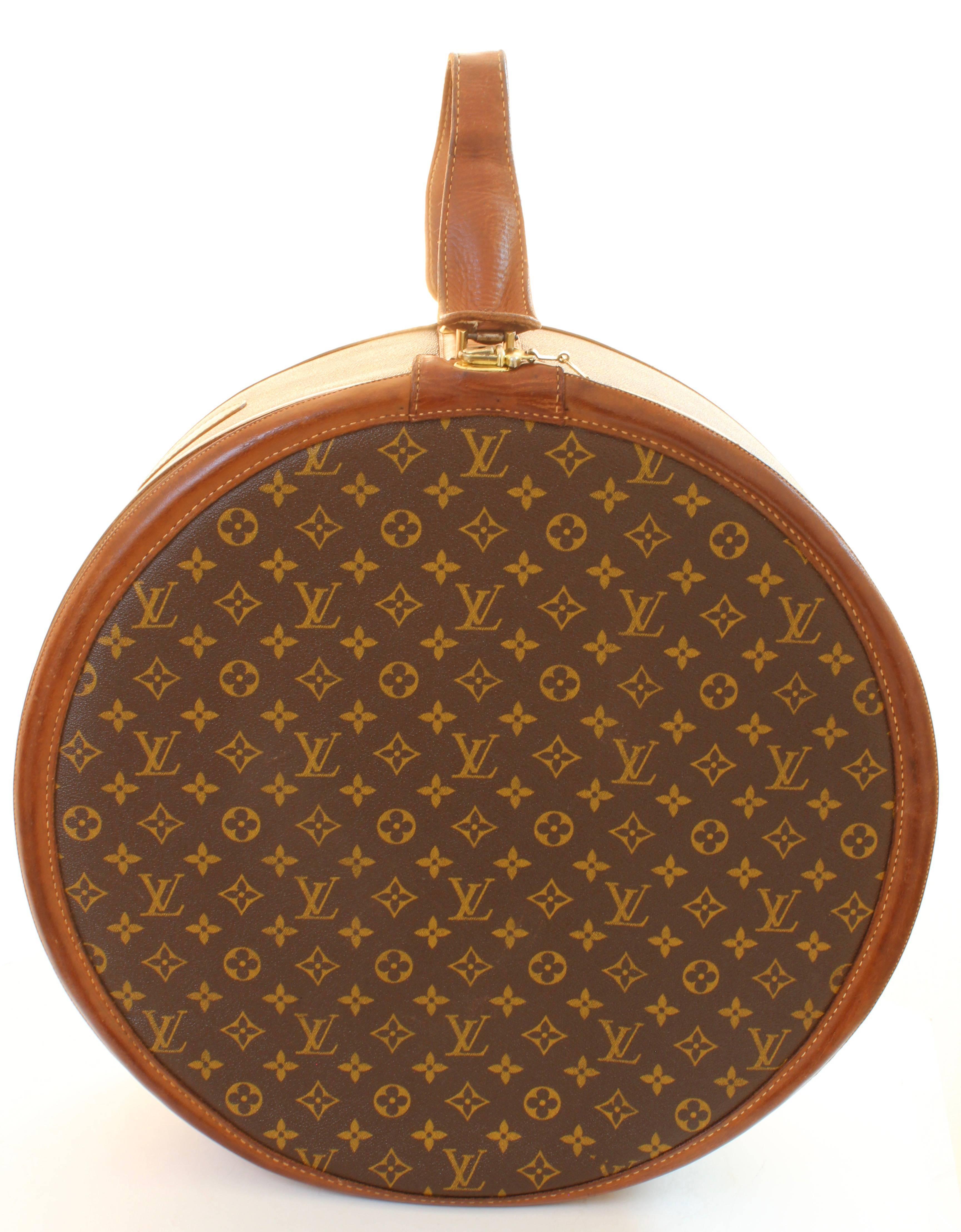 Travel in style with this fabulous round hat box or Boite Chapeaux from Louis Vuitton, and manufactured by The French Company under special license from LV in the 1970s.  Made from monogram canvas, its trimmed in finished leather and fastens with a