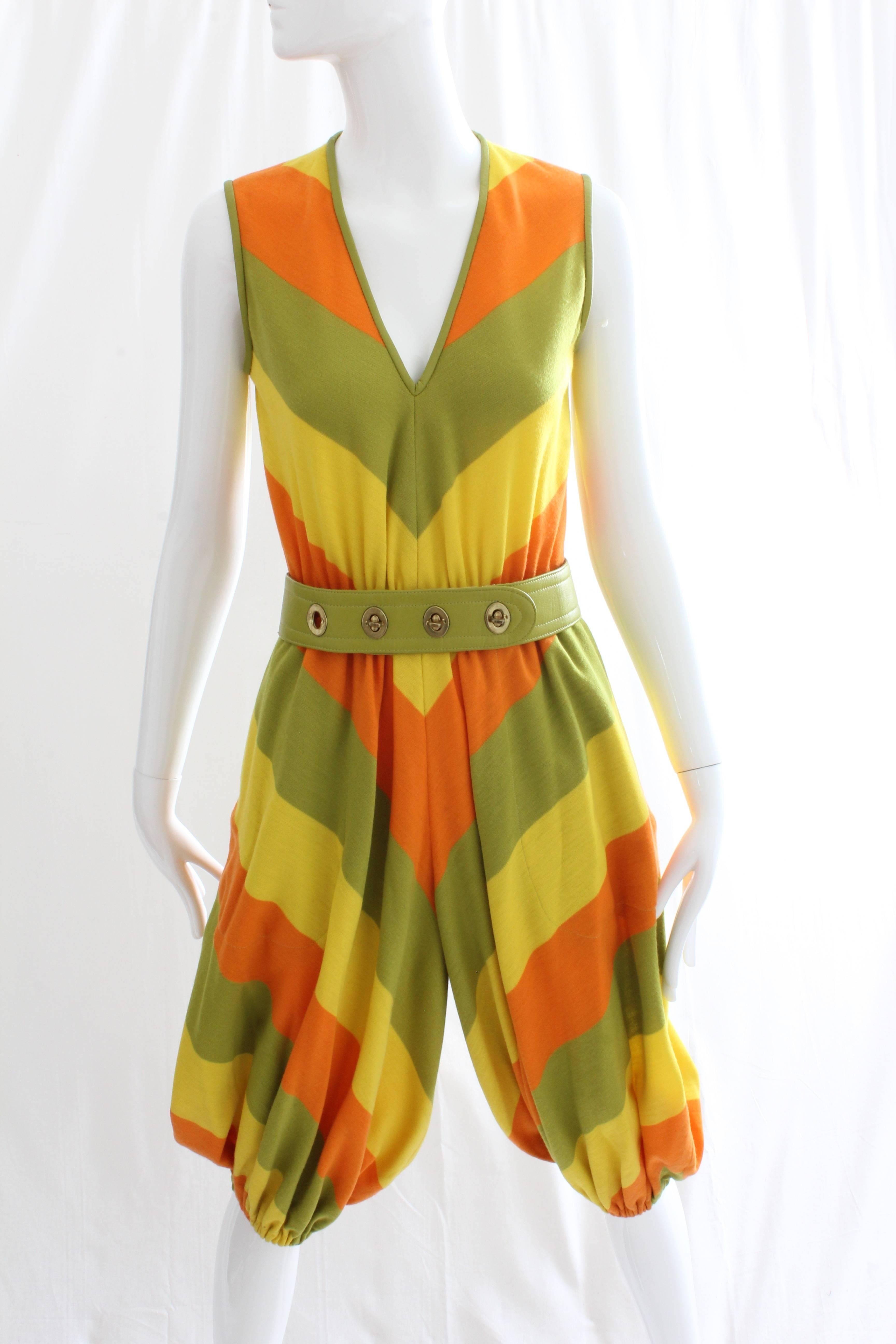 This incredibly rare jumpsuit was designed by Bonnie Cashin during her time at Sills in the 1960s. Made from a soft wool jersey fabric in bright shades of melon, lime and lemon, it features lime leather trim and comes with a matching brass turnlock