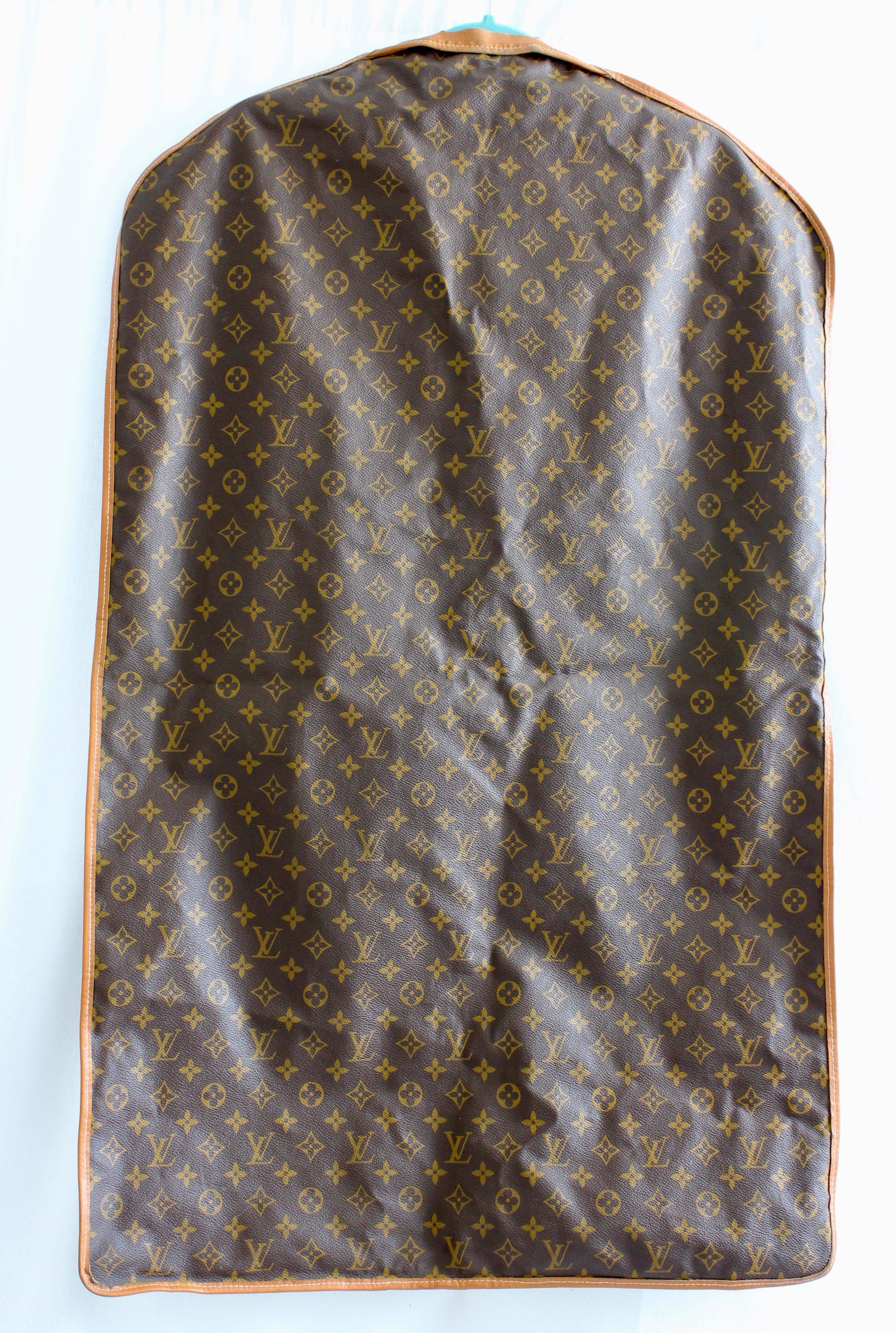 Here's a chic little garment bag made by The French Company and Louis Vuitton for Saks Fifth Avenue, most likely made in the 1970s.  Made from their signature monogram canvas, it's trimmed in leather and features a leather loop at one end and an