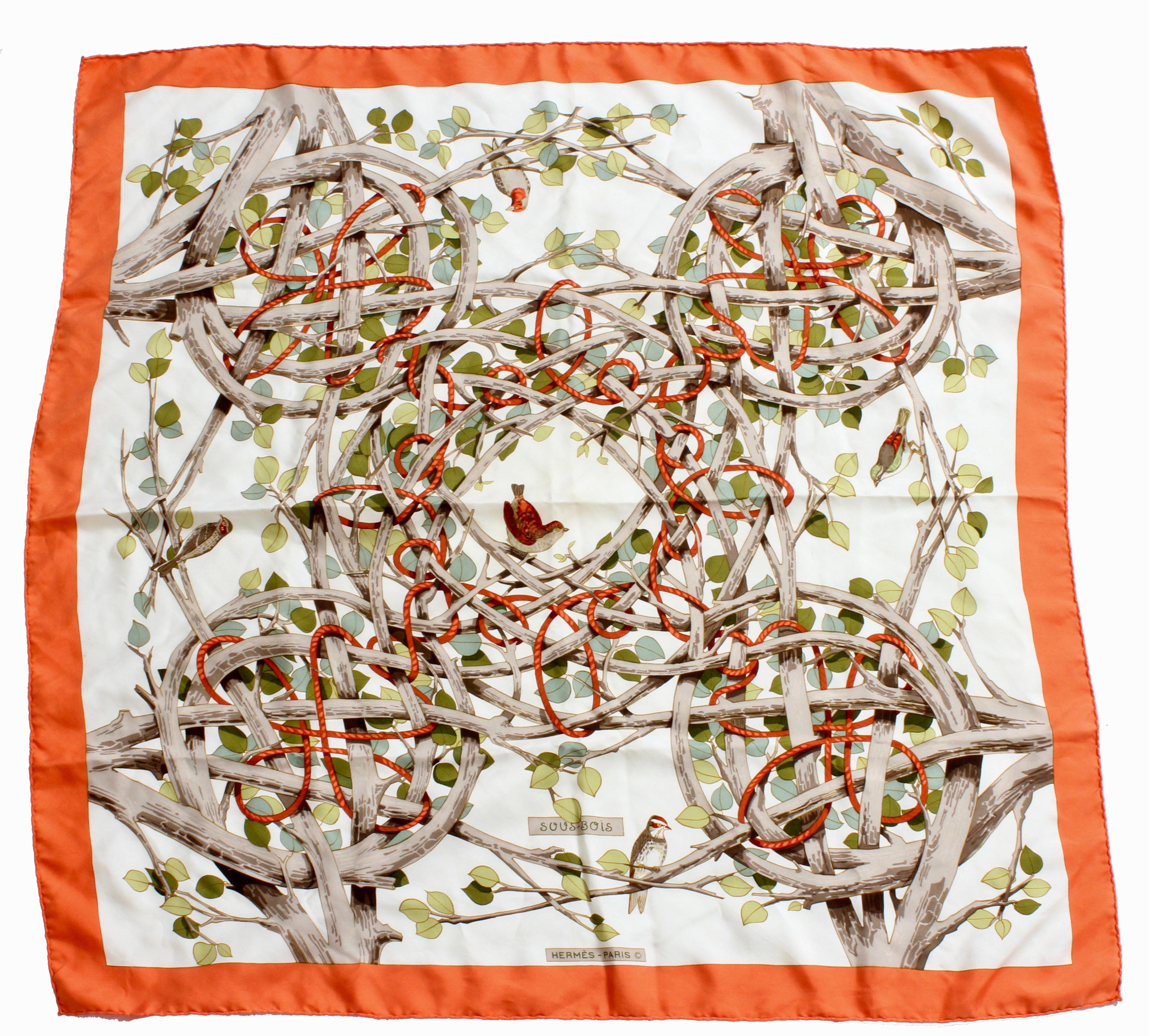 This fabulous and rare silk twill scarf or shawl was made by Hermes, most likely in the mid 1950s.  Designed by artist Francoise Heron, this piece is titled Sous-Bois, and features birds nestled within leafy branches and rope. Made from silk twill,