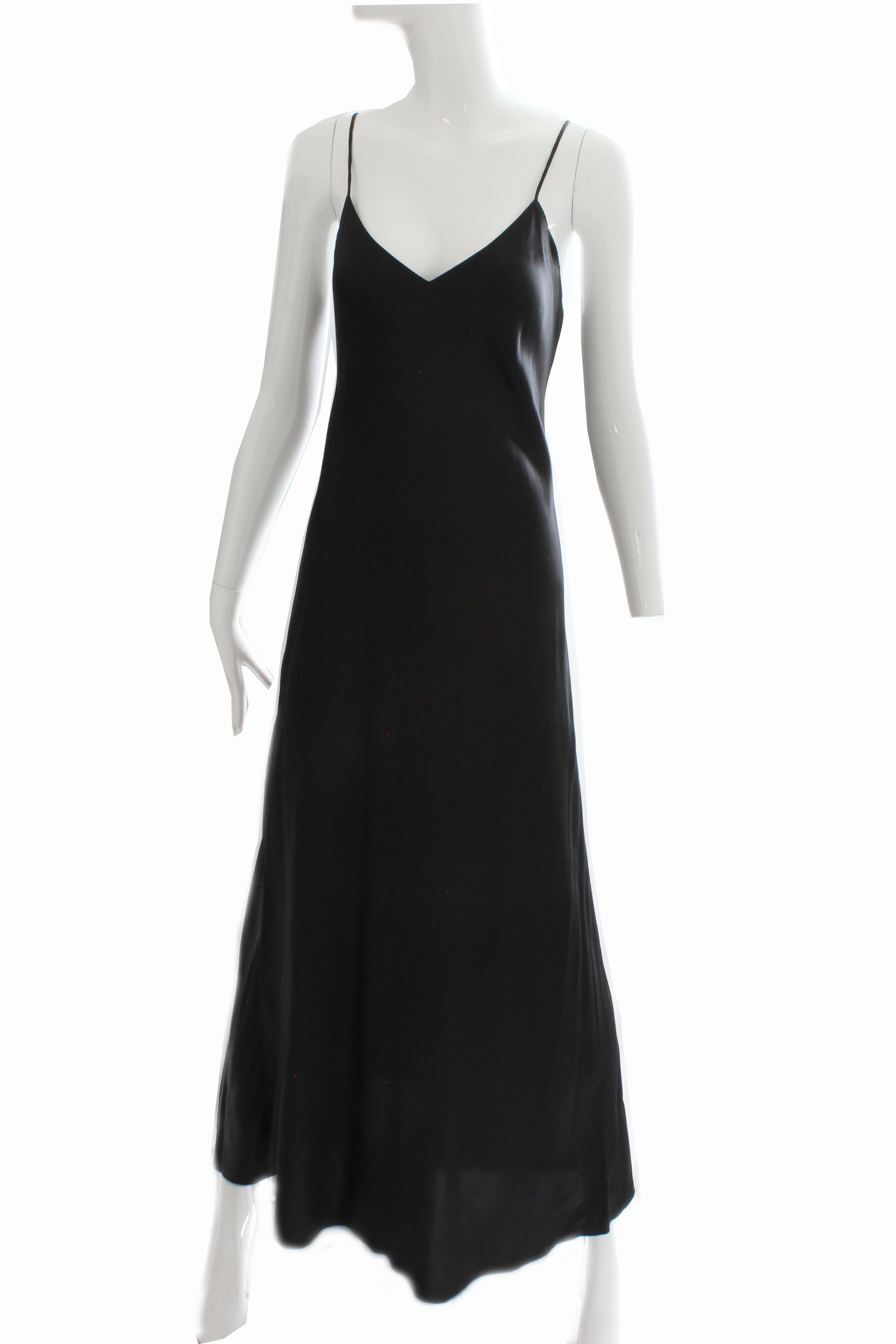 This chic long black dress was made by Saks Fifth Avenue, most likely in the early 1990s.  Made from a gorgeous black silk charmeuse fabric, this piece is unlined, simple and elegant.  Tagged Saks Fifth Avenue, 100% Silk and size M, it measures: