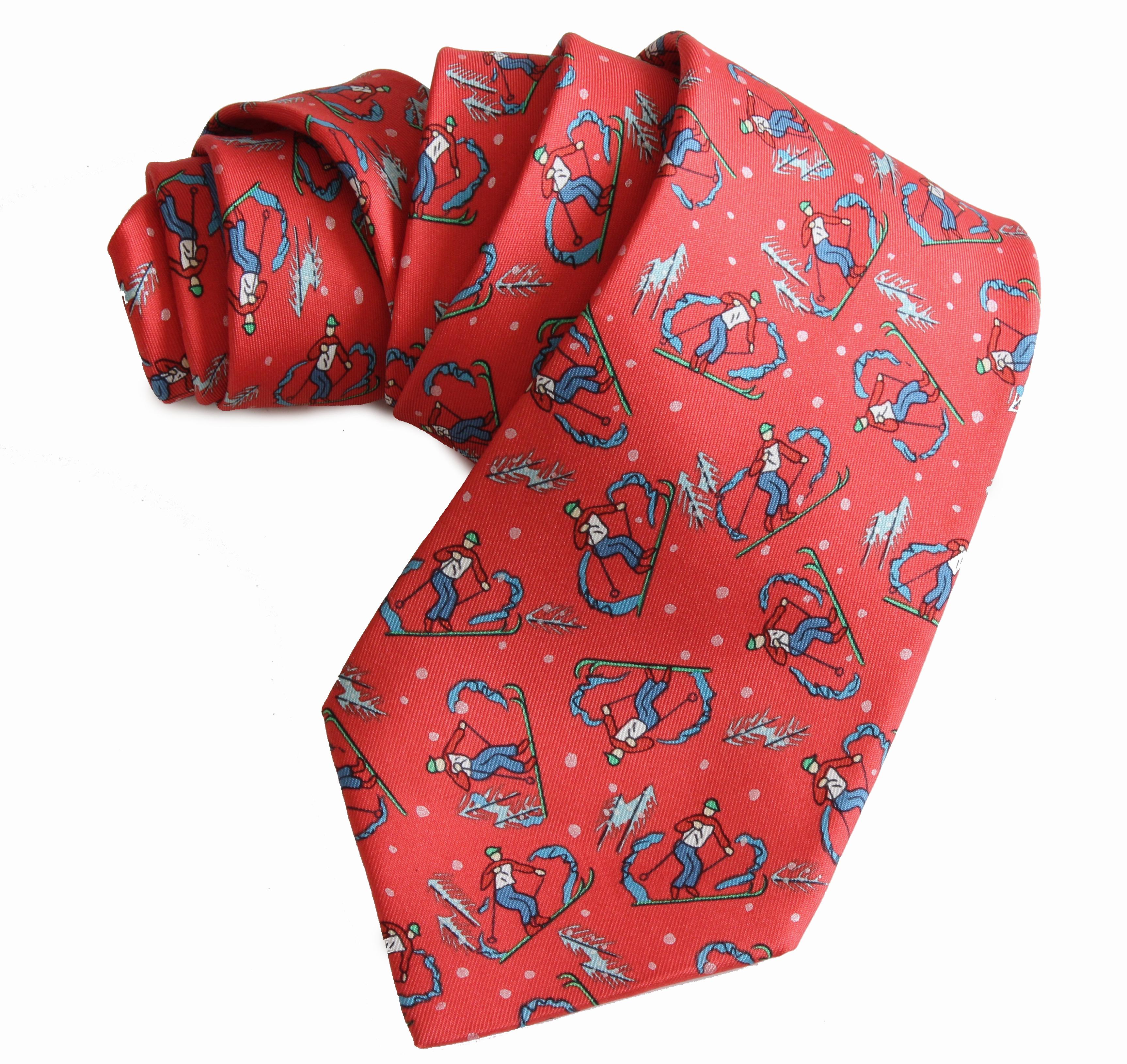 Here's a whimsical mens neck tie from Hermes Paris.  Made from silk twill, it features colorful downhill skiers against a red background.  In very good preowned condition with minimal signs of prior wear.  It measures appx 59in L x 3.75in at the