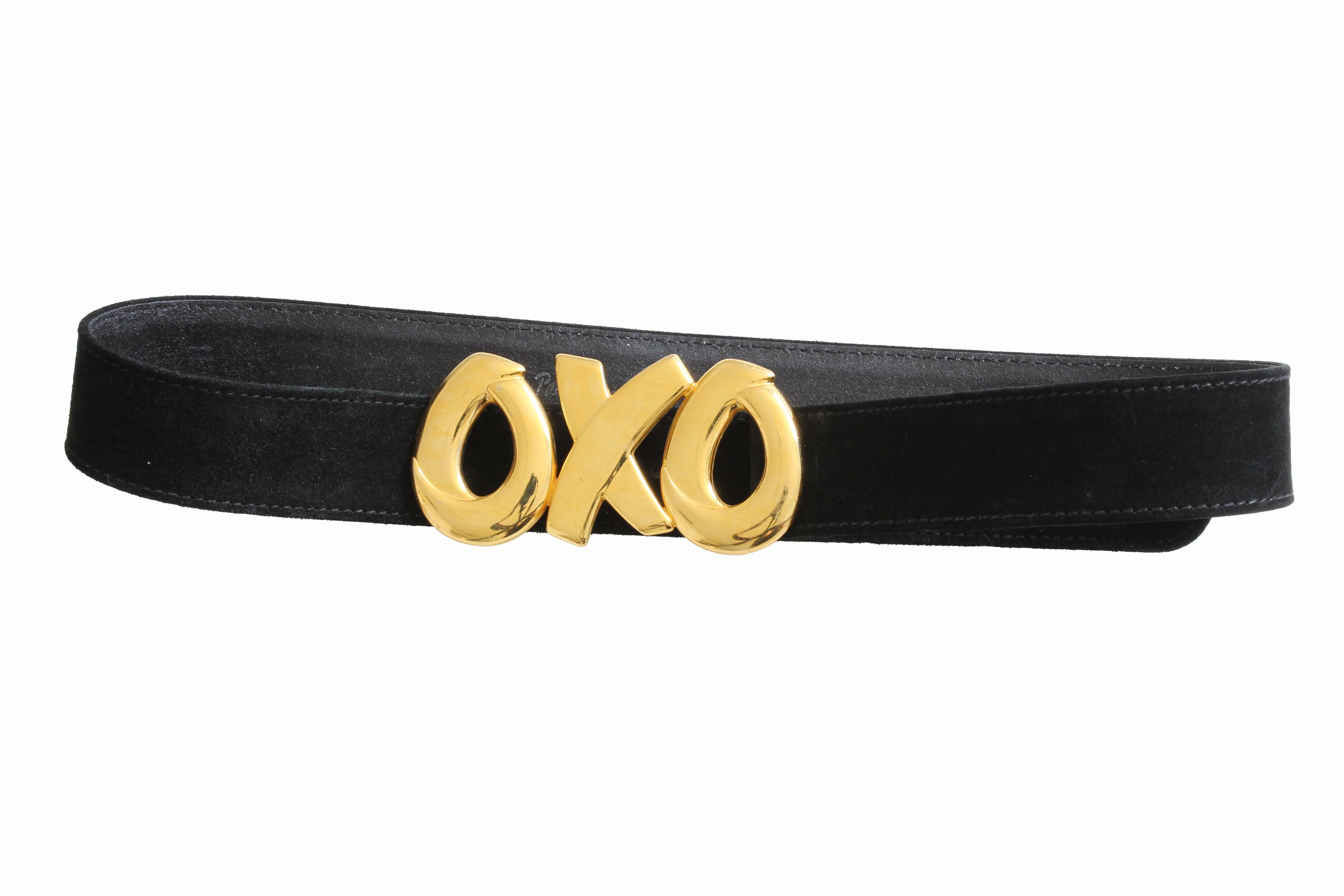 Here's a cool belt from Paloma Picasso! Made from black suede leather, the buckle features her signature OXO logo.  The buckle measures appx 4in L x 2.2in H and the belt strap measures 1.25in H.  Best fits a waist between 29in and 31in.  In good