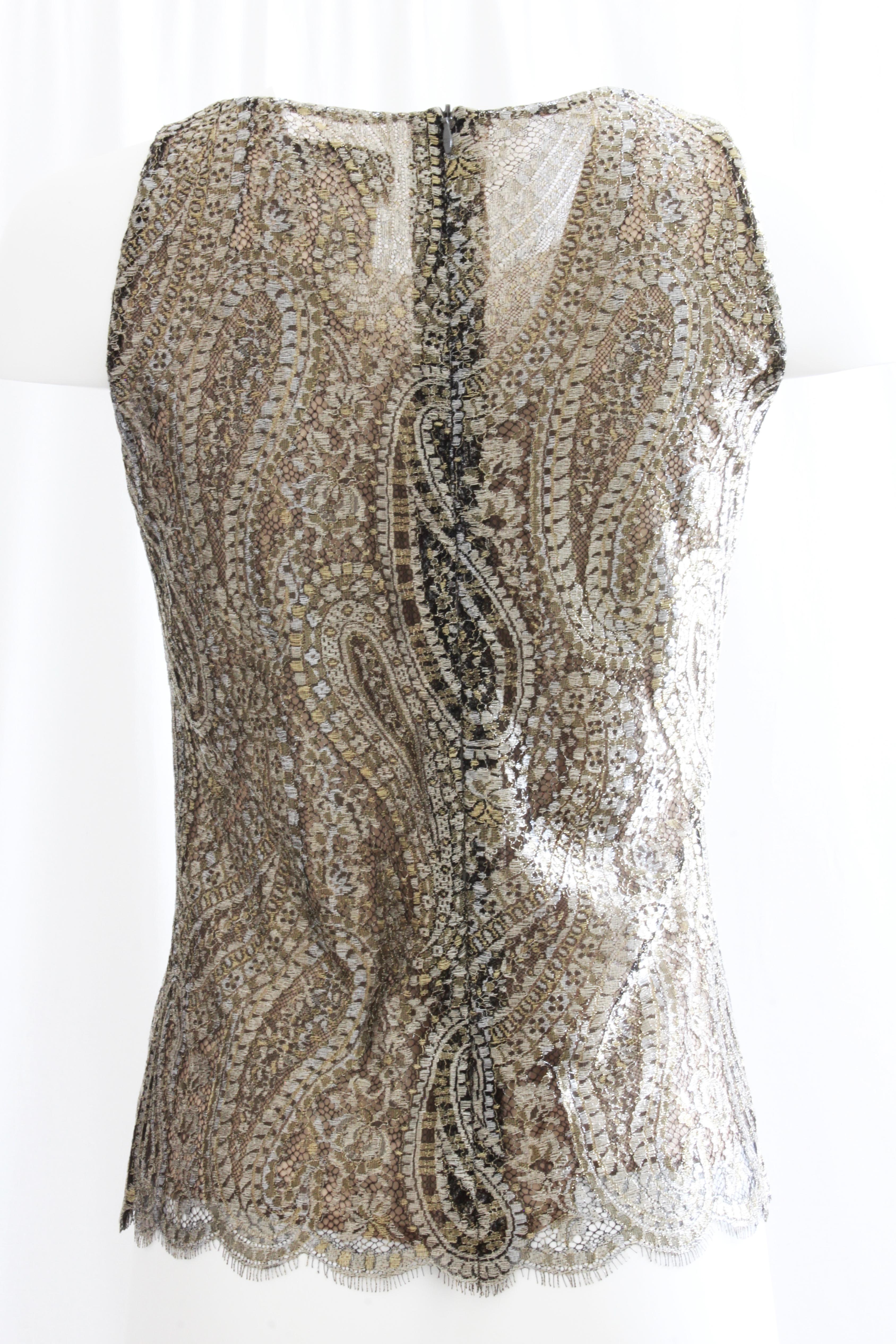This lovely sleeveless top was made by Chanel for their 2013 collection.  Made from a stunning gold tone metallic lace in a paisley motif, it's lined in nude silk fabric.  Fastens with a hidden rear zipper and looks amazing with black (as shown in