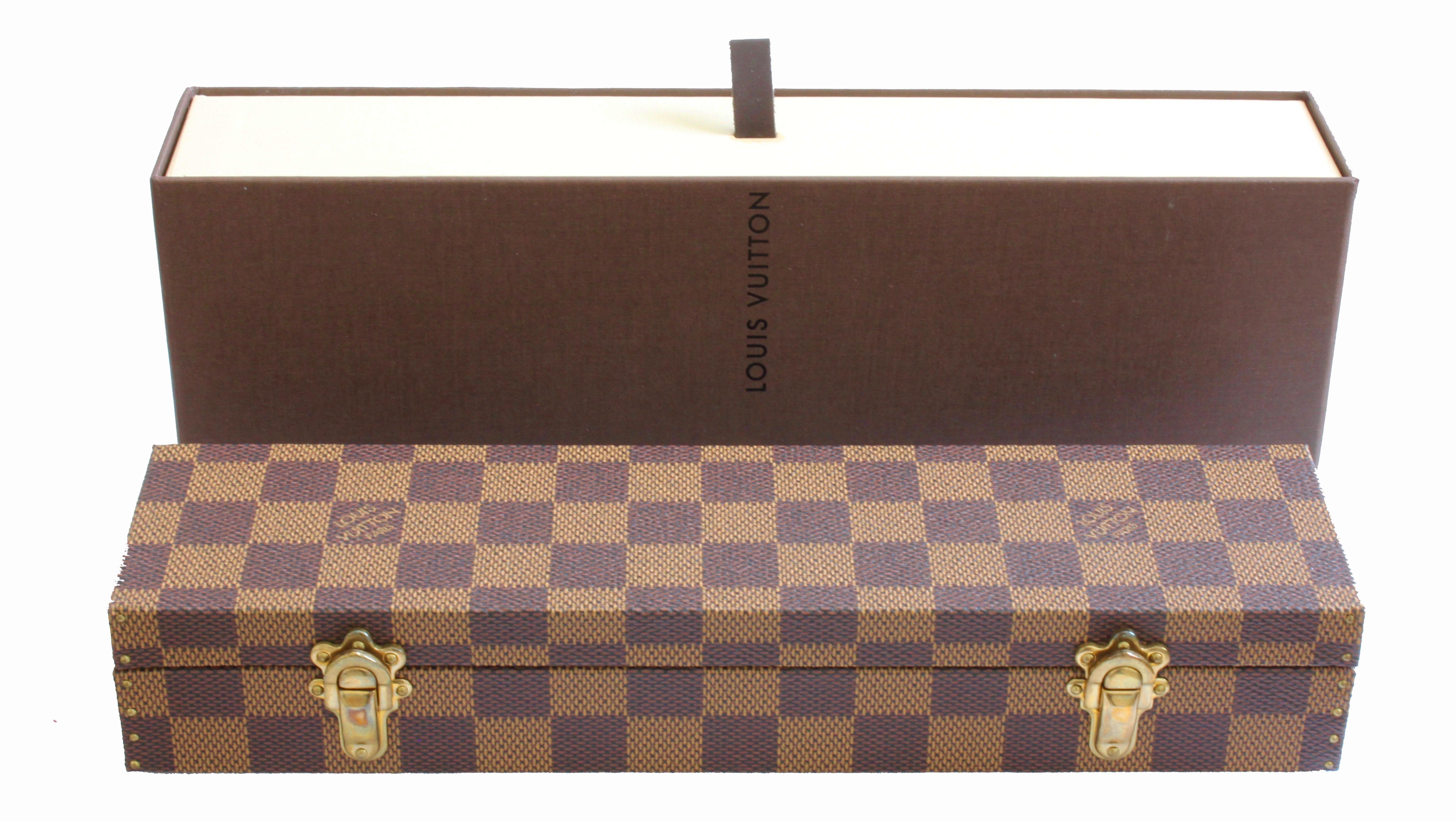 This fabulous mini trunk was made by Louis Vuitton in 2004, but is new in box, never used.  So hard to find in this lovely Damier checker pattern and in this condition! Perfect for stowing your small jewelry items and measures 10.5in L x 2.5in D x