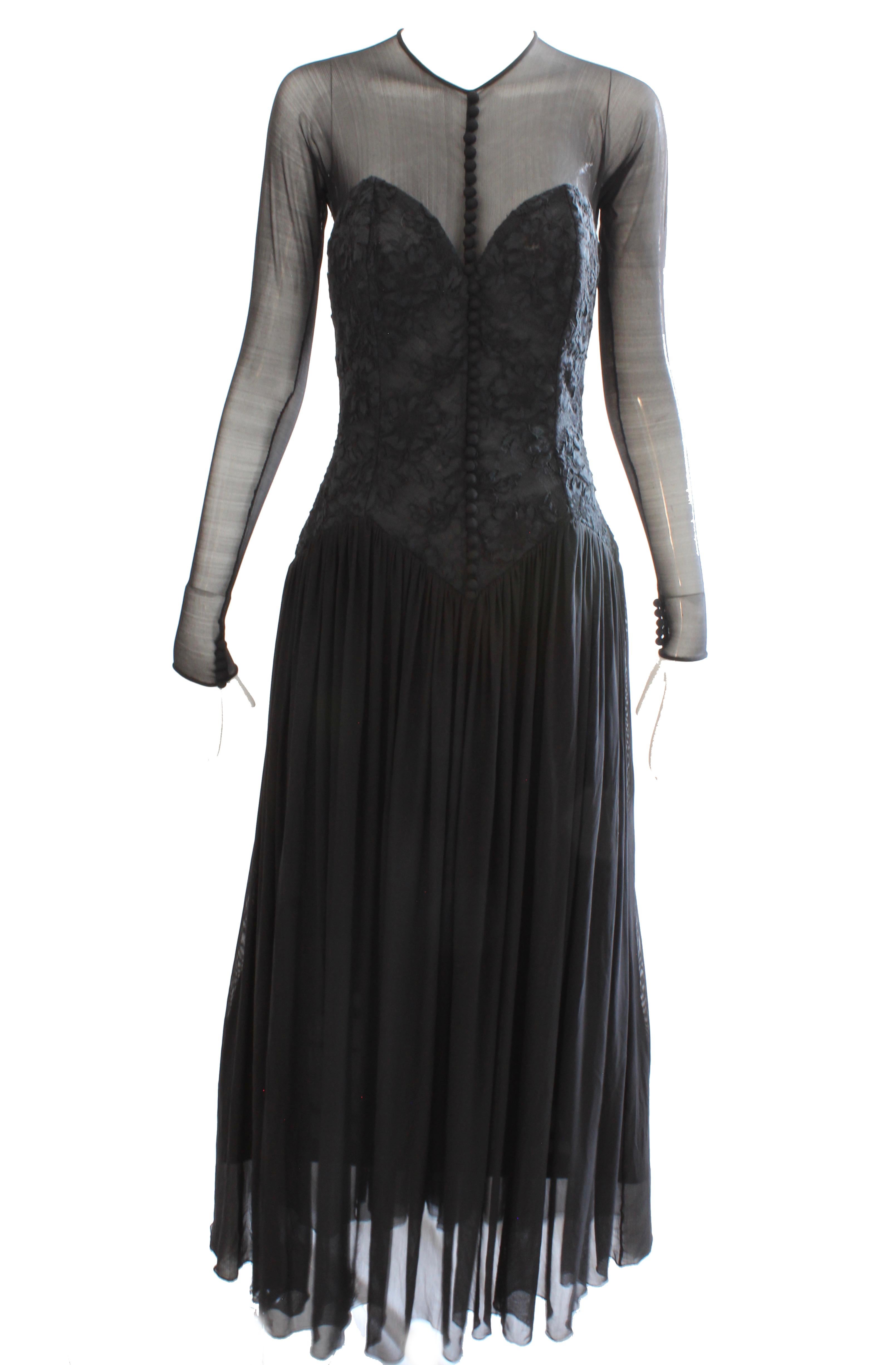 Here's a pretty formal dress from Vicky Tiel Couture, likely made in the 1990s.   It features a corset top with floral embroidery and sheer sleeves and chest, with panels of black mesh as the skirt.  Fastens in back with a zipper and single button