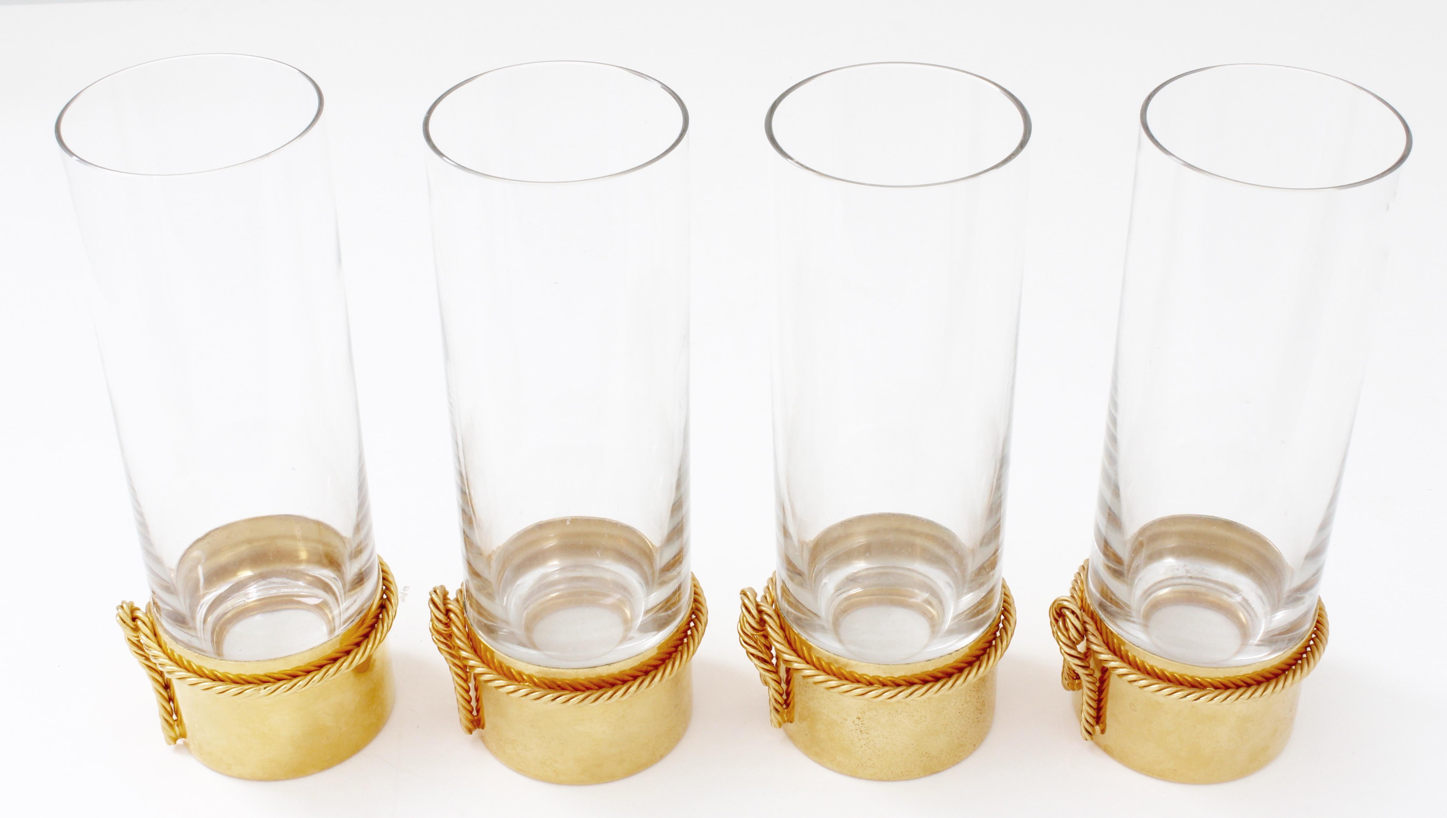 Celebrate in style with this 4pc set of super rare cocktail glasses, made in Italy by Gucci.  Made from crystal and plated in gold, they feature twisted rope detailing at the base.  Each glass measures approximately 6.5in H x 2.25in across the top,