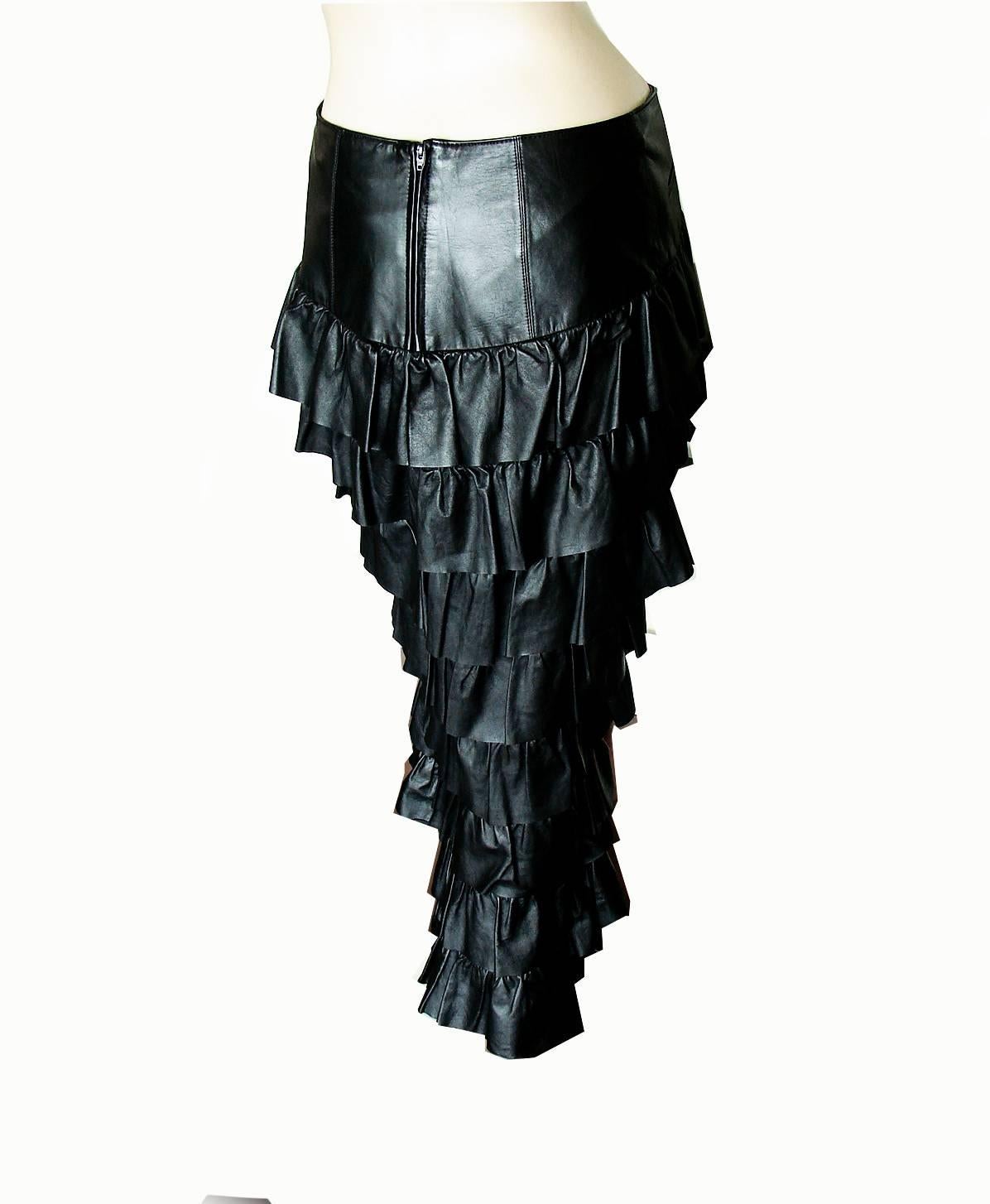 This fabulous skirt is from the Chanel Fall 2001 Collection. Made from the softest calfskin leather, it features rows of gorgeous layered leather ruffles with
sheer panels underneath.  The front has a sleek leather panel that is shorter in front