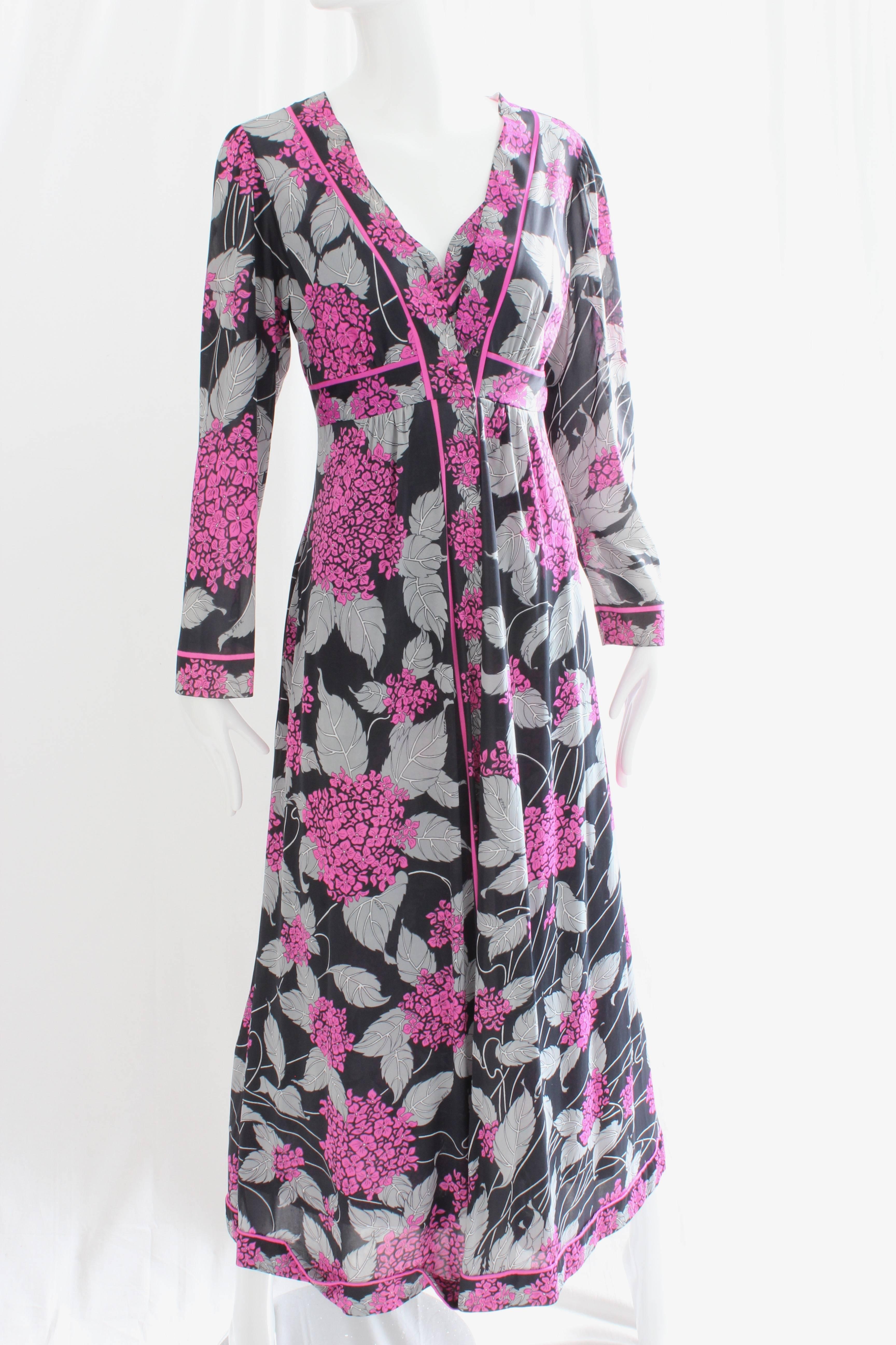 Here's a lovely long nightgown and robe set from EMILIO PUCCI for Formfit Rogers. Made lightweight poly fabric, it features a gorgeous pattern of brilliant lilacs with grey and white leaves against a black background.   In very good preowned