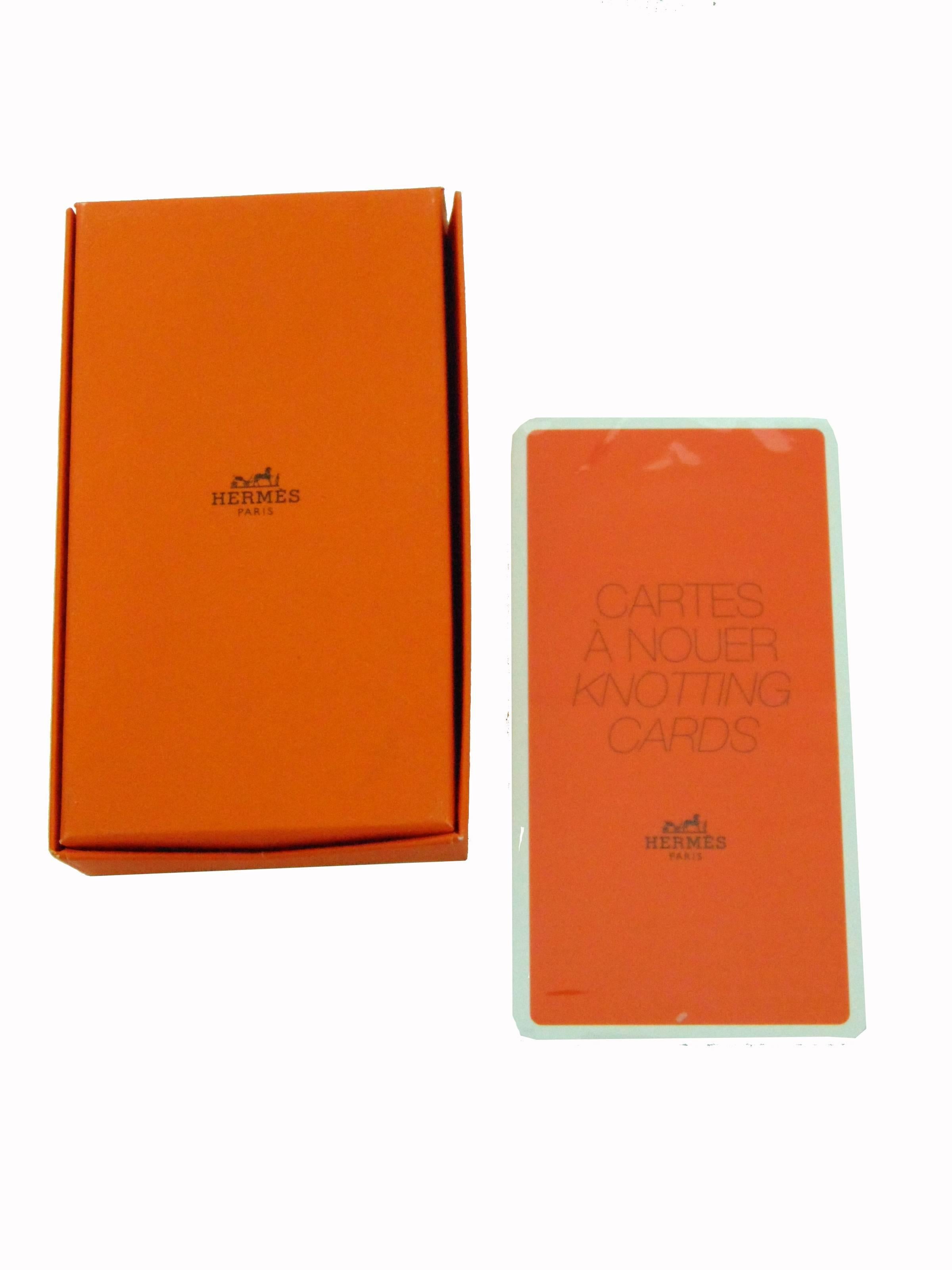 A boxed set of knotting cards from Hermes, which provide detailed instructions and photo examples on different ways to tie their scarves and shawls.  This set is new and unopened.  