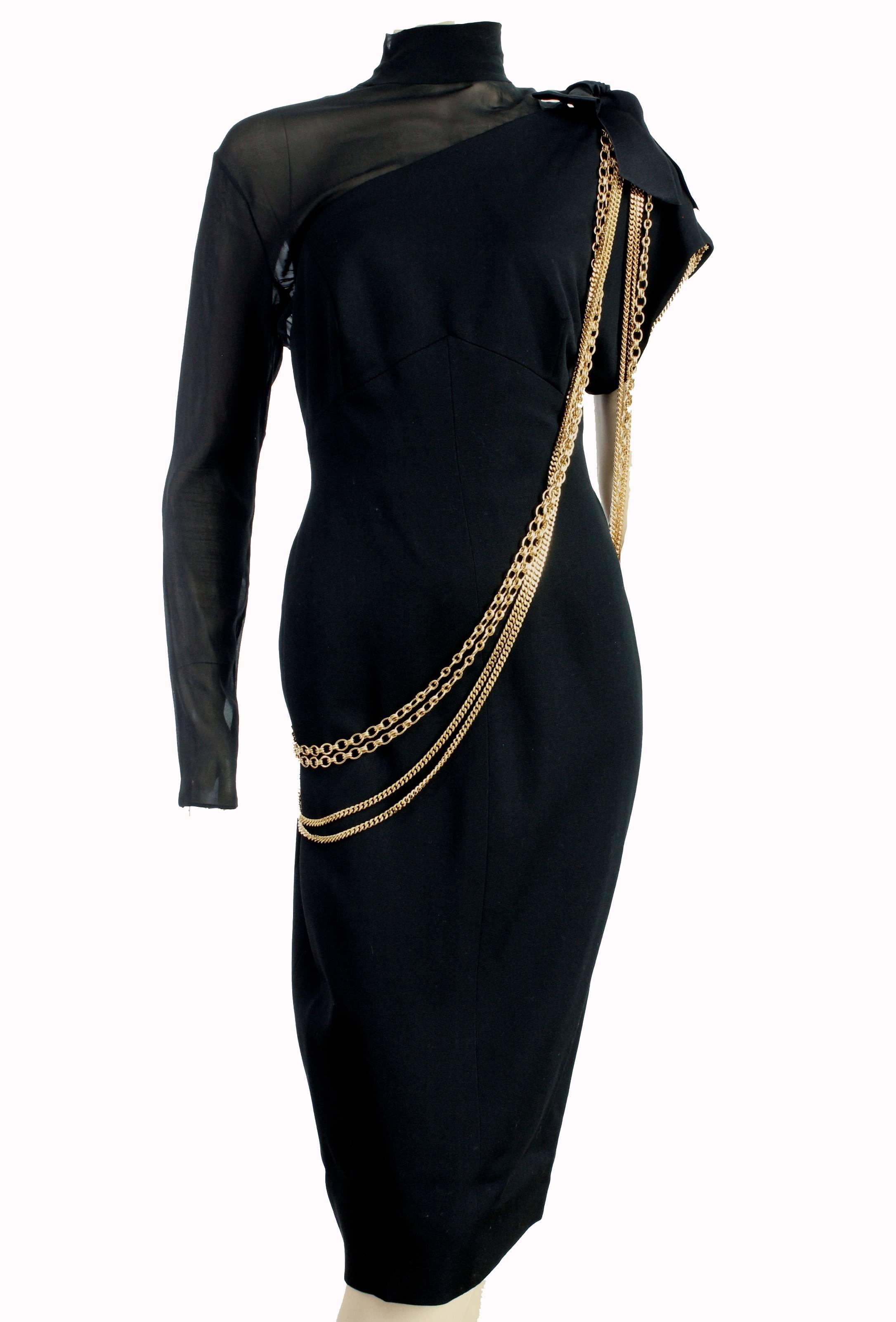 This little black dress was designed by Chanel in the early 1980s, just after Karl Lagerfeld took over as head of design.  Made from black wool, the back and right arm are covered in sheer black silk, with silk satin bows on the left shoulder and