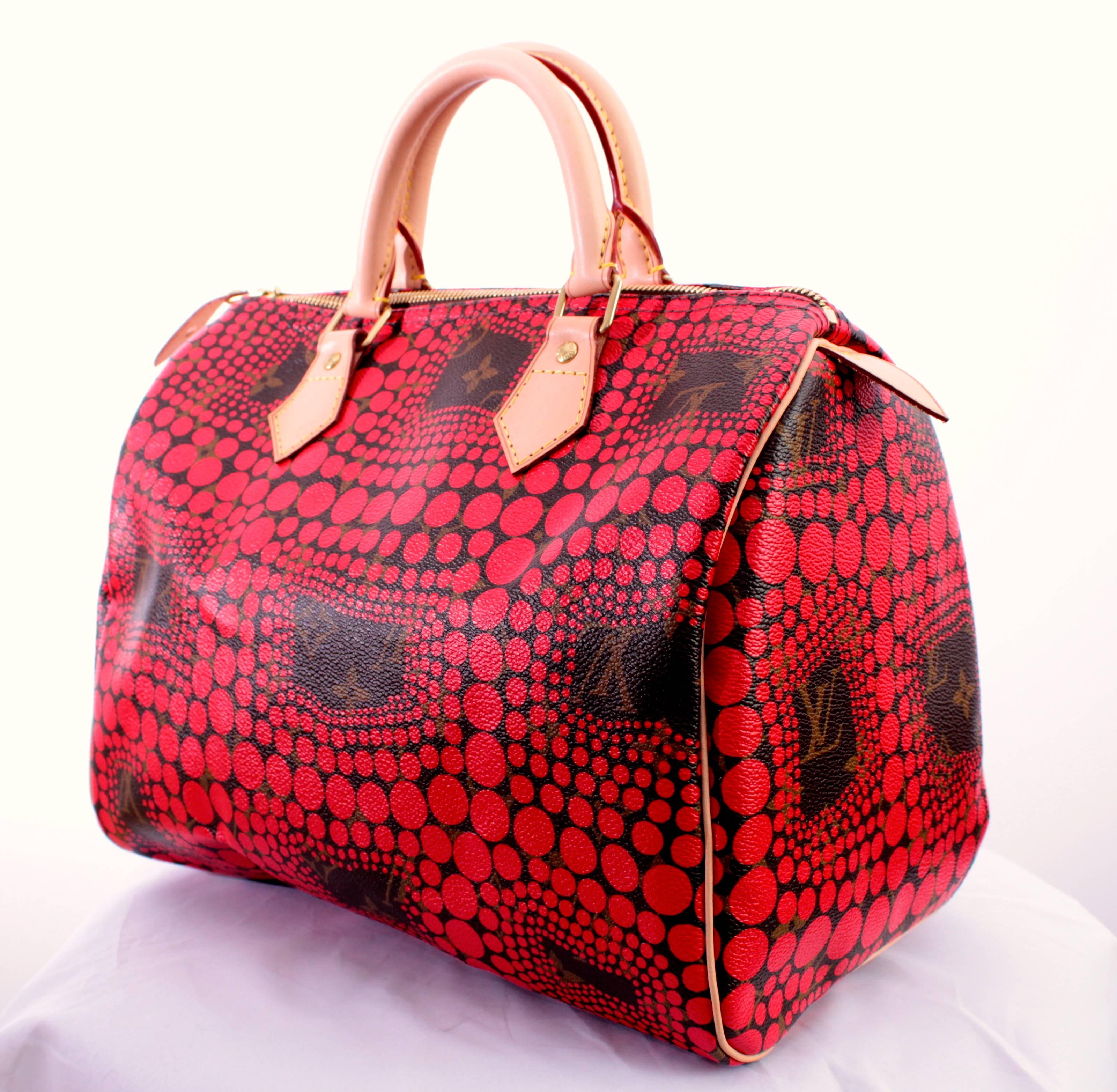 This lovely bag was designed by Yayoi Kusama as a limited edition in collaboration with Louis Vuitton.  In excellent preowned condition, this bag was carried for about two hours during a photo shoot, with the only thing keeping us from calling it