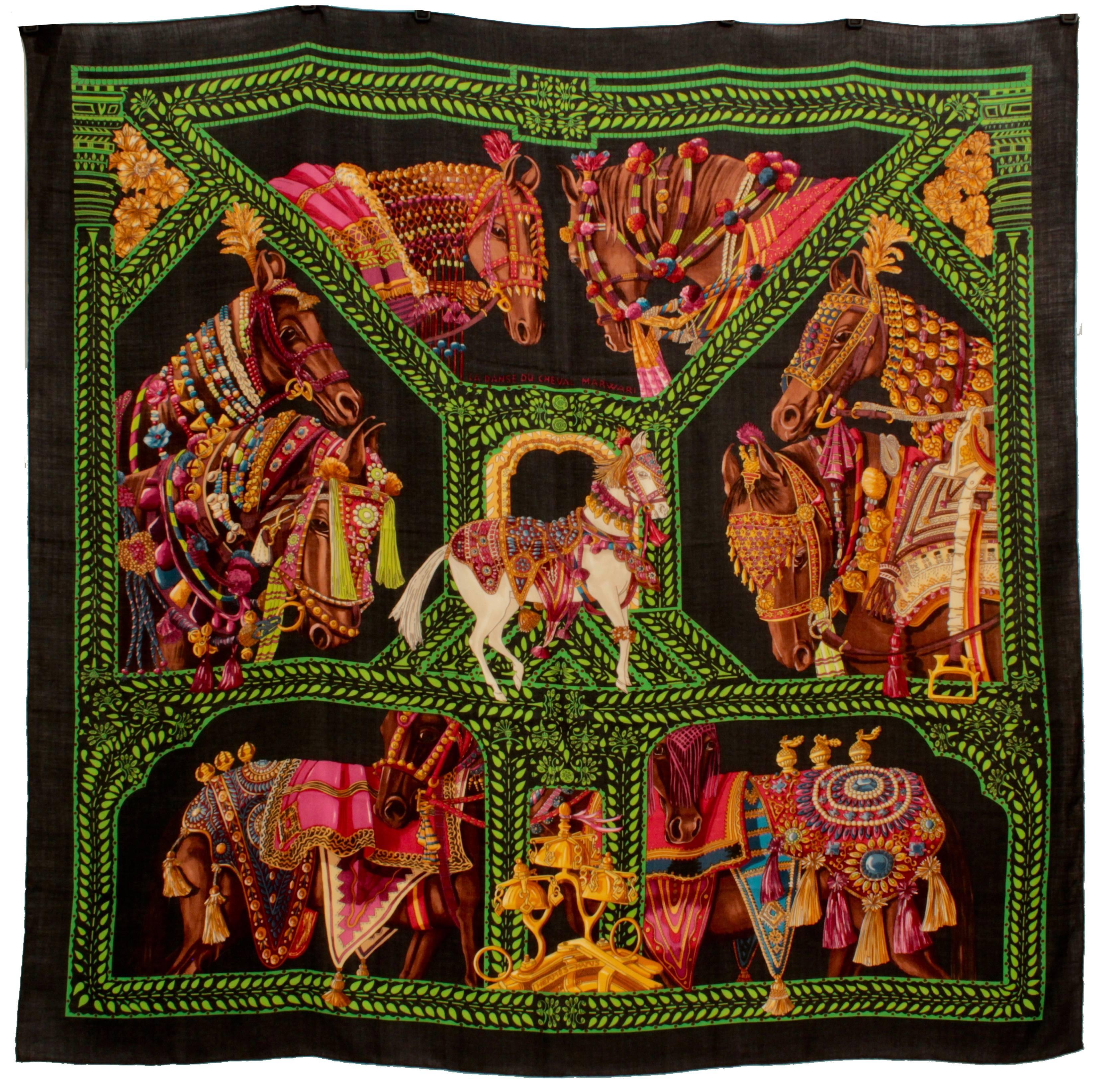 This is one of our favorite Hermes La Maison Des Carres prints from designer Annie Faivre - and in our favorite colorway of jewel tones against a black background.  La Danse du Cheval Marwari was released as a 140cm (55 inch) cashmere and silk shawl
