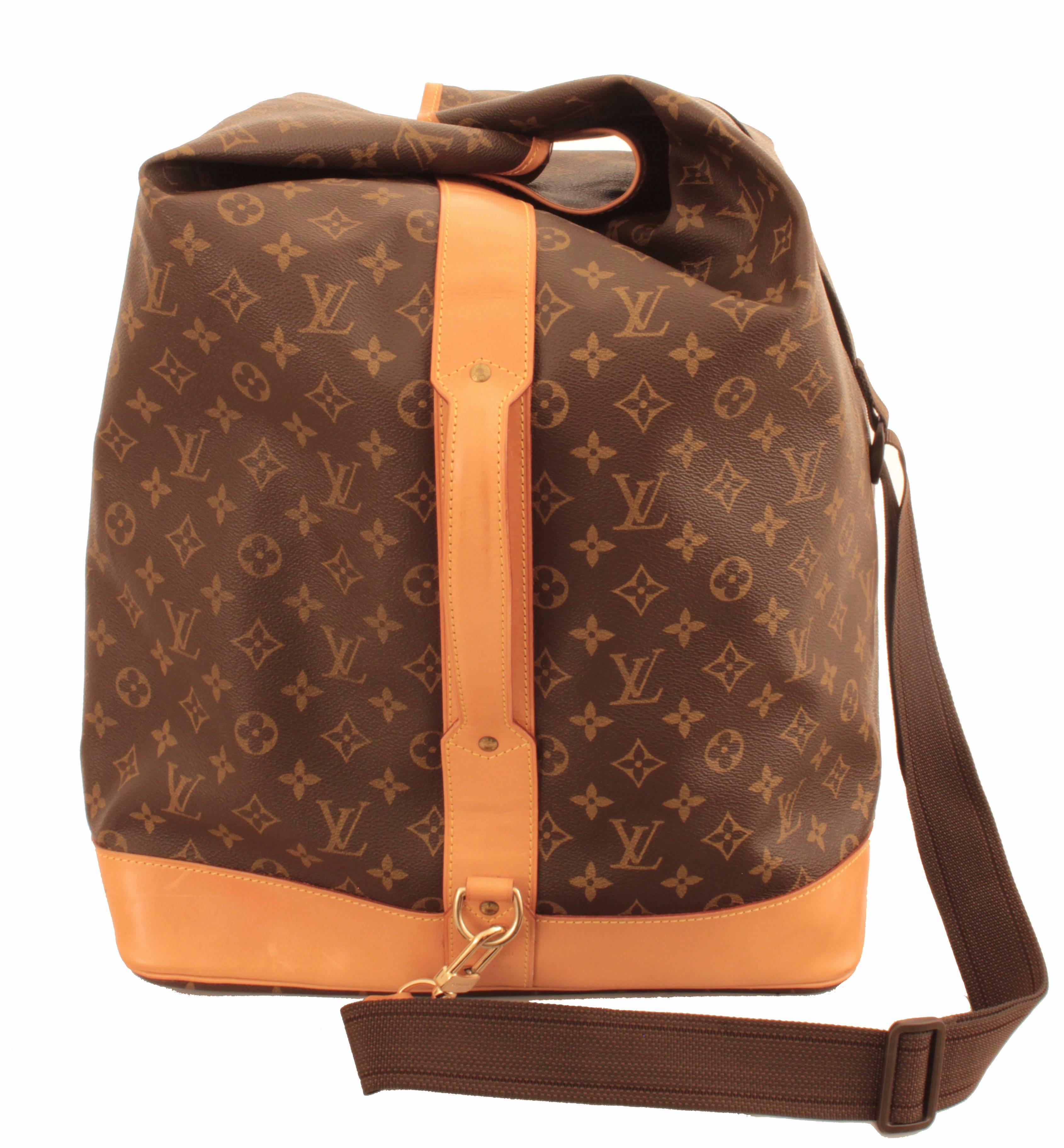 Travel in style with this incredible Louis Vuitton monogram Sac Marin PM, manufactured in 1996.  Note that this is the more popular PM version, which can easily be used as carry-on luggage when flying, and currently retails in as a Damier special